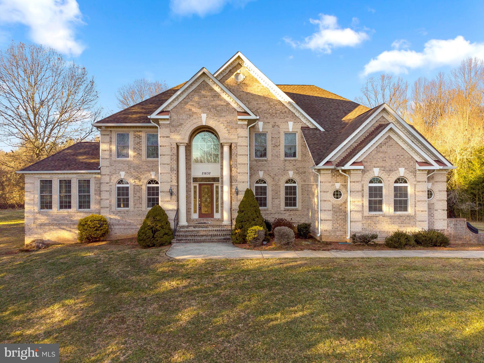 OPEN HOUSE SATURDAY 2/12 1-3PM! Welcome to this gorgeous custom built home with all the bells and whistles! Gleaming hardwood floors throughout the main level! Luxurious details include tray ceilings, columns, crown molding, chair railings, wainscoting, arch doorways and more!! Gourmet kitchen with center island, granite counters, and ceramic tile floors. Two-story great room with gas fireplace. Main level also includes two-story foyer, formal living room, formal dining room, sun room, laundry room, and powder room! Upper level features spacious owner's suite with gas fireplace, cathedral ceilings, walk-in closet and spa-like bath complete with garden tub, double sinks, and glass enclosed shower. Second bedroom features it's own private bath. Lower level rec room is huge! Lower level also includes full bath, 5th bedroom, and storage room. Awesome and private backyard that backs to trees!