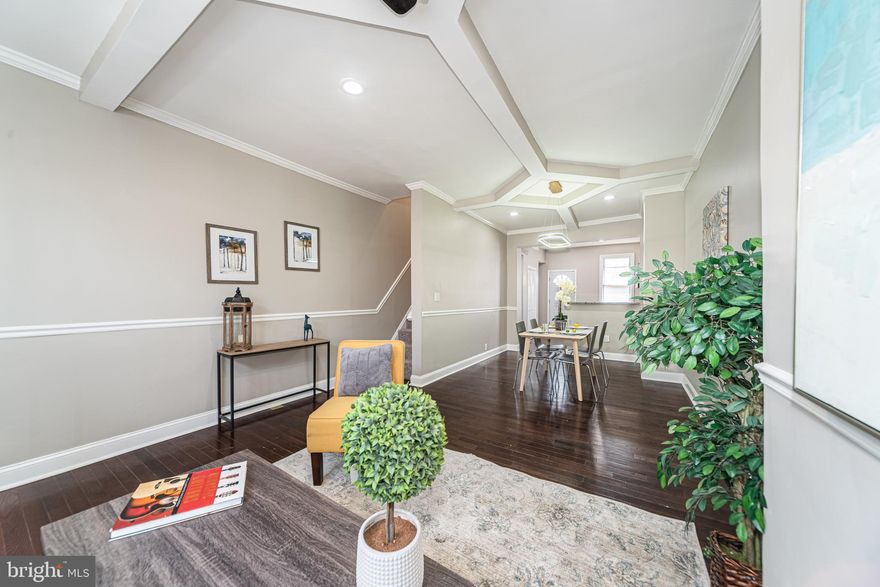 PICTURE PERFECT WASHINGTON VILLAGE RENOVATION WITH 3 FINISHED LEVELS OF LIVING SPACE! 
 Features include an open floor plan, wood floors & chair rail throughout the main level, spacious living room w/ a dining area, updated kitchen w/ granite counters, ss appliances & tile backsplash, upper level with 3 bedrooms and 1 full bath, a finished basement with a family room, 4th bedroom, & 2nd full bath, a rear deck, and a fenced yard.  Conveniently located close to major roadways, stadiums, downtown Baltimore, and UMMC