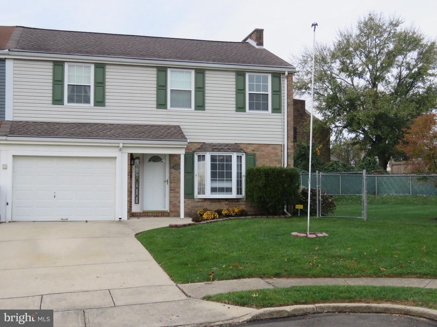 3 Bedroom, 2.5 bath end unit townhome in desirable Neshaminy Valley. Kitchen has tile floor, granite counter, Kenmore gas stove, GE microwave and refrigerator, Kitchen Aide dishwasher and pantry. Laundry room has Samsung dryer, Speed Queen washer, sink and cabinets for storage. Family room has Berber carpet and recessed lights. Office/Den has cathedral  ceiling, 2 skylights and ceiling fan with light package and door leading to concrete patio. Rear yard is huge, fenced and has a paved basketball court. Master bedroom has walk in closet and full bath.  2 other good sized bedrooms with ceiling fans and hall bath complete the 2nd floor. Pull down stairs for  storage in attic. HVAC system is Trane and gas water heater is a Bradford White. 2nd refrigerator in garage stays, freezer in garage is excluded.  Valley Elementary is an  excellent school in Bensalem Twp. Call today and schedule a visit, you'll be impressed!
