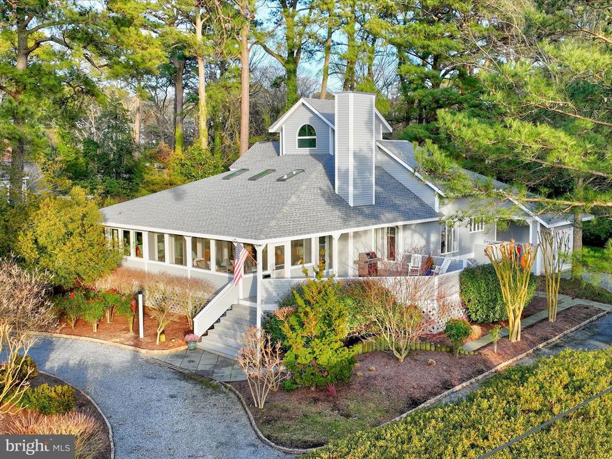 Rare opportunity to reside in the sought-after coastal town of Henlopen Acres, with its award-winning tree canopy and exclusive homes offering unparalleled privacy and convenience to both the private Henlopen Acres Beach Club and the small town charm of Rehoboth Beach. Nestled between the Atlantic Ocean and the picturesque Lewes and Rehoboth Canal, this 5-bedroom and 4-bathroom home is within walking distance to downtown Rehoboth Beach and just a block and a half stroll to the private Henlopen Acres Beach Club and tennis courts. Savor ocean pine breezes while entertaining guests on the comfortable, interconnected 3-season porch, sunroom, and expansive TimberTech decks, complete with a gas line for grilling.  The panoramic sunset views of the Henlopen Acres Marina and preserved wetlands create a captivating backdrop and transform your living space into a haven for relaxation and natural beauty.

The interior boasts soaring beamed cathedral ceilings with skylights, towering windows, and french doors flooding the open-concept living space with natural light.  Wide plank heart of pine floors and a recently converted gas fireplace enhance the main living area’s warmth. The kitchen features modern stainless steel appliances and bright white cabinets, creating a sleek and timeless aesthetic.  With ample counter seating for four, the open kitchen seamlessly connects to the dining and great room.  This design enhances the home’s spacious and interconnected feel, ideal for daily living and grand entertaining. 

Additional main level features include a spacious light-filled owner’s suite with canal views, a guest room, a full bath, a private Nanny/guest suite, a laundry room with a second refrigerator, a walk-in pantry/storage room with two entry points, and a mud room with entrances from the side drive and the back yard. The central illuminated staircase rises to two additional private guest rooms with a convenient Jack and Jill bathroom.  The loft and office spaces offer versatility and functionality, while the attic provides extra storage.  Experience a unique birds-eye view of the expansive great room and dining areas cascading to the inviting porch rooms, creating a harmonious flow through this thoughtfully designed home.  Sited on a generously sized .52 acre lot, the stately circular front drive and second long drive provide coveted off-street parking. Mature shade trees enhance the professionally landscaped outdoor oasis.  Also included is a storage room for bikes and boards, an outdoor shower, a well, and an irrigation system.  Explore the potential for a pool and hardscaping, complete with a fire pit, creating the perfect setting for memorable moments with family and friends.  Please come take a look and realize the limitless potential this rare opportunity will afford the discerning buyer.  Be sure to preview the attached video.

The Town of Henlopen Acres reserves the first right of refusal on all sales.  Please find the Charter and Codes on the HenlopenAcres.Delaware.gov website detailing an architectural review process for improvements and construction in addition to rules governing rentals. An initiation fee and annual dues are required for HABC membership.