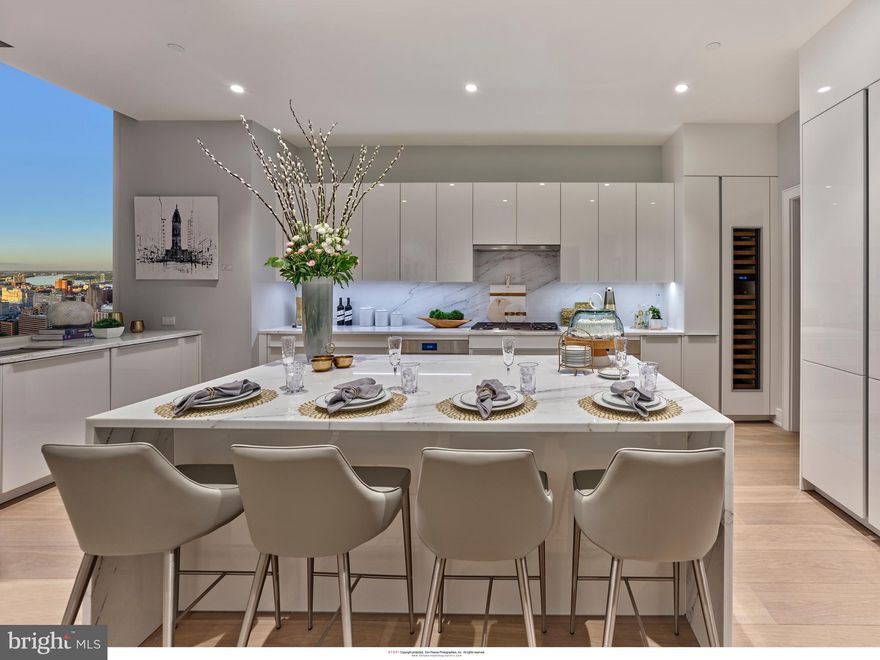 Presenting Penthouse 1 at Arthaus, an extraordinary expression of refined urban living in Philadelphia’s prestigious Avenue of the Arts. Occupying Level 41 of the iconic Arthaus tower, this full-floor residence spans 4,284 square feet and features two weather-protected balconies, offering seamless indoor-outdoor living high above the city.

The Gallery sets the tone upon arrival—10-foot ceilings and recessed lighting create a museum-like atmosphere, evoking the grandeur of the Louvre. This formal entry establishes a sense of arrival and frames the home as a true collector’s residence.

To the west, the Great Room commands attention, offering a dramatic 52-foot entertaining space with sweeping skyline views. A private home library, enclosed by double doors and illuminated with recessed lighting, provides the perfect canvas for a bespoke interior design vision—ideal for a curated, one-of-one aesthetic. 

The chef’s kitchen is designed for serious culinary pursuits, featuring Poggenpohl cabinetry, a full Wolf and Sub-Zero appliance suite with gas cooktop, an oversized island, and a large butler’s pantry—ideal for private chefs or elevated entertaining. The family room off the chef’s kitchen is the perfect place to re-connect with loved ones at the end of the day. 

Penthouse 1 features three bedrooms, four lavish baths, and an additional powder room, delivering both sophistication and effortless comfort.

Arthaus amenities redefine luxury living, including a 75-foot indoor heated lap pool, comprehensive wellness facilities, and exclusive access to a BMW 750 with a personal driver. Residents enjoy a rooftop all-season greenhouse, dog run and pet spa, and an outdoor terrace with fire pits, grilling stations, and al fresco dining areas.

Located just steps from world-class performing arts venues, fine dining, and with seamless access to major sports arenas and PHL International Airport, Arthaus represents the pinnacle of cosmopolitan living in Philadelphia.

The Penthaus Collection at Arthaus is not simply a residence—it is a lifestyle statement.