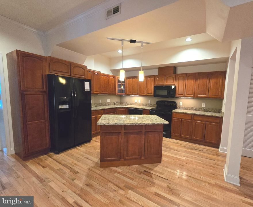 Welcome  Home!! to this gorgeous 2 Bedroom, 2 full bath condo in the Arts District of Downtown.  This gem has a GOURMET kitchen with GRANITE countertops and tons of cabinets.  The gleaming hardwood floors, and exposed original brick set off with the many windows add so much character and warmth.  One level main floor living at it's finest.  You don't want to miss this one.  It's a charmer!