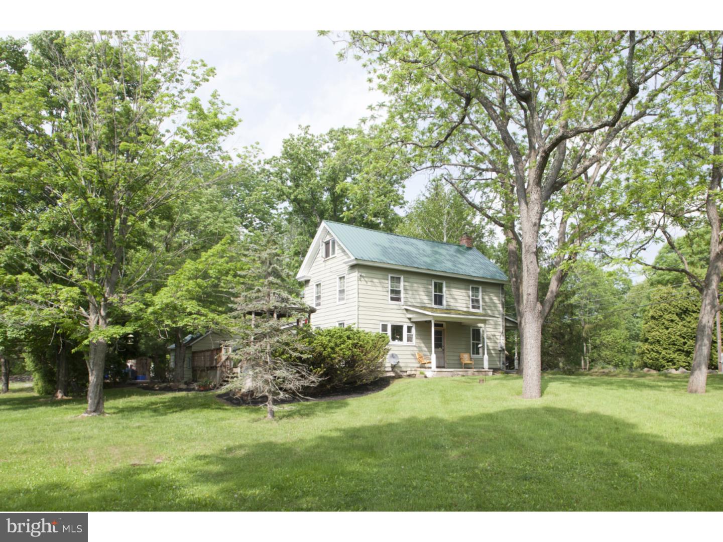 This classic and humble 1820's farmhouse is set on a serene and bucolic 3 acres, enveloped by mature trees, a sweeping lawn, and perennials to enjoy all summer long from the tiered back deck and gazebo. Nature lovers will appreciate the variety of wildlife on this country property that can be viewed from multiple covered porches. The house features a generous sized kitchen, living room with wood burning stove, and dining room on the first floor, as well as a powder room and laundry facility. Upstairs are 3 bedrooms, and a full bath. The finished attic is a generous sized 4th bedroom or bonus space. Antique hardwood floors throughout and an outdoor brick smoke house are just a few of the preserved features of this historic home. Circular drive, stone walls, and a 20x40 garage/workshop complete the exterior features. Conveniently located close to NJ, 78, and 611.