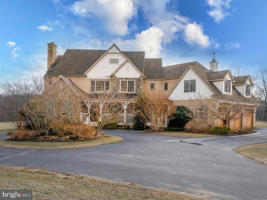 Set on 5.5 private acres within Indian Run Farm, this custom-built Weaver Construction residence is offered for the first time and presents a rare combination of timeless craftsmanship, generous living space, and a serene natural setting. Located in Malvern, the property offers convenient proximity to Main Line amenities, major commuting routes, regional rail, and the Tredyffrin/Easttown School District.  The home offers over 5,100 square feet of thoughtfully designed living space with 4 bedrooms, 5 full bathrooms, and 1 half bath.  A welcoming foyer is flanked by a light-filled home office with custom built-in cabinetry and a formal dining room, setting a refined yet inviting tone. The gourmet kitchen serves as the heart of the home and is equipped with stainless steel appliances, including a Thermador six-burner range with griddle, Miele double ovens and warming drawer, hot water-on-demand faucet, and a GE Monogram side-by-side refrigerator. Extensive cabinetry, a large center island, and space for a generously sized dining table create a warm gathering space well suited for hosting. The adjoining family room features a beamed ceiling, radiant heated floors, and a custom Franklin wood-burning fireplace. Large windows and French doors open to the rear porch, filling the space with natural light and offering views of the expansive backyard. A tiled rear entry from the three-car garage includes a walk-in closet, wine pantry, powder room, and mudroom with built-in storage for everyday organization. Upstairs, the primary suite provides a private retreat with views of the backyard, a walk-in closet with custom built-ins, and an en-suite bathroom featuring a double vanity, radiant heated floors, tiled walk-in shower, and private water closet. Three additional bedrooms, each with en-suite bathrooms and ample closet space, complete the second level, along with a second-floor laundry room.  The fourth bedroom features two adjoining rooms for added living flexibility. An open office area with built-in desks allows for work or relaxation options. The unfinished walk-up attic offers abundant storage or future expansion potential. The lower level includes a recreation room with space for games and seating, a full bathroom, multiple storage areas, and interior access to the garage, with additional unfinished space suitable for a home gym or storage. Outdoor living areas include pollinator-friendly gardens, a custom paver patio, fire pit, a rear porch, and a wraparound front porch, providing multiple inviting spaces to enjoy the surrounding landscape. Nearby access to trails and open space, including Valley Forge National Park and Cedar Hollow Preserve, further enhance the setting. Additional features include a Navien Energy Star tankless water heater, Sunny Boy solar panel system, EV charger, generator connection, underground electrical wiring, and an attached three-car garage with interior access and additional storage. The property offers a rare combination of peaceful, private setting and convenient access to Routes 202 and 30, the PA Turnpike, and regional rail, supporting easy travel throughout the Main Line and beyond. This residence presents an opportunity to enjoy refined living, space, and privacy while remaining closely connected to the lifestyle and conveniences associated with Main Line living.