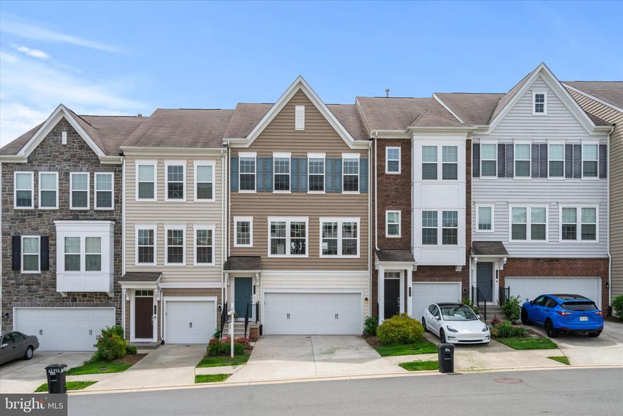 Welcome to 19961 Major Sq!

This stunning townhome is located in a prime Ashburn location and features the highly sought-after Surrey model. From the moment you walk in, you'll notice the fresh, modern paint that brightens the space, paired beautifully with hardwood floors that flow throughout the main and lower levels.

The main level boasts an open-concept layout, ideal for everyday living and entertaining. The upgraded kitchen is a true highlight, featuring a large center island with seating and pendant lighting, sleek quartz countertops, an abundance of white cabinetry, a spacious pantry, a 5-burner cooktop, a built-in microwave/oven combo, and stainless steel appliances.

Adjacent to the kitchen is a spacious family room and a designated dining area that can easily double as a breakfast space. The main level is flooded with natural light and includes a thoughtfully designed built-in mini office with plenty of cabinetry and storage—perfect for working from home.

There’s also a stylish upgraded powder room and easy access to the large Trex deck, which includes an upgraded built-in natural gas quick connect—no more propane tanks—making it perfect for summer grilling!

The lower level features a finished bedroom, a full bathroom, access to the garage, and a walk-out to the spacious concrete patio and backyard. The finished bedroom features built in surround sound speakers and can double as an entertainment space.

Upstairs, the expansive primary suite includes a large walk-in closet and a beautifully upgraded en-suite bathroom with a frameless glass shower featuring dual shower heads and seating, double vanities with ample counter space, and a private water closet. You'll also find two additional generously sized bedrooms, an upgraded full bathroom, and a conveniently located laundry room on the upper level.

Parking is a breeze with your 2 car garage with updated epoxy flooring and concrete driveway. You also have an abundance of visitor spots available for your guests.

This home is located in a top-rated school district and just minutes from Route 7, Route 28, Dulles Airport, and all the shops, dining, and entertainment at One Loudoun. You'll also be within walking distance to 132-acre Bles Park, which offers scenic trails along the Potomac River, soccer fields, wetlands, and upcoming upgrades including a new playground with rubber surfacing, five picnic pavilions, a canoe/kayak launch, and more.

Additional highlights include a MyQ smart garage system, allowing you to open and close the garage door remotely from anywhere in the world. The backyard is equipped with a HomeTeam Pest Defense system, enabling exterior pest treatments that reach inside the walls—no need for service providers to enter the home. A radon detector is also installed in the attic, offering added peace of mind with continuous monitoring.

This home truly has it all—in one of the most desirable communities in Ashburn.

Open House Friday 4:00pm-7:00pm and Saturday 12:00pm-3:00pm and Sunday 1:00pm-3:00pm