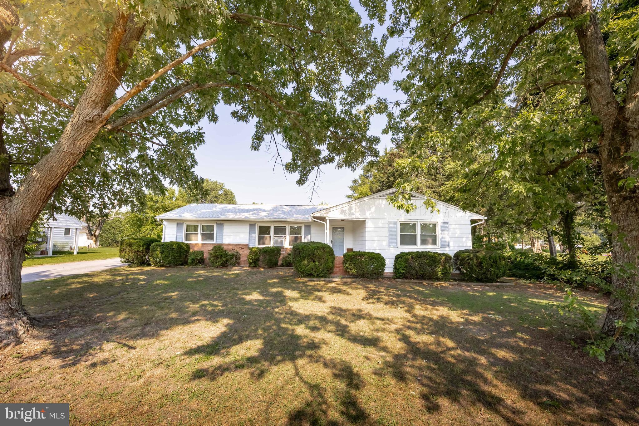 Don't miss this chance to own a home in the Mardela Middle & High School district. This home backs right up to the school property and is just a very short distance to Northwestern Elementary. This home with a traditional floor plan offers a hint of mid-century modern design and is ready for your personal touch. There are harwood floors under the carpet in the living room, dining room & bedrooms. Just a little creativity and some updating will transform it into an adorable home. AI generated photos have been added to allow buyers to see the renovation possibilities. It has been owned by the same owner since it was built. This home was lived in by the original owner and the new roof was just replaced last year, windows have been replaced. Septic had minor repairs done and was inspected by Blue Wave Environmental just two years ago. Enjoy the freedom of no HOA restrictions with this "AS IS"sale, allowing you to make it your own. Schedule a showing today!