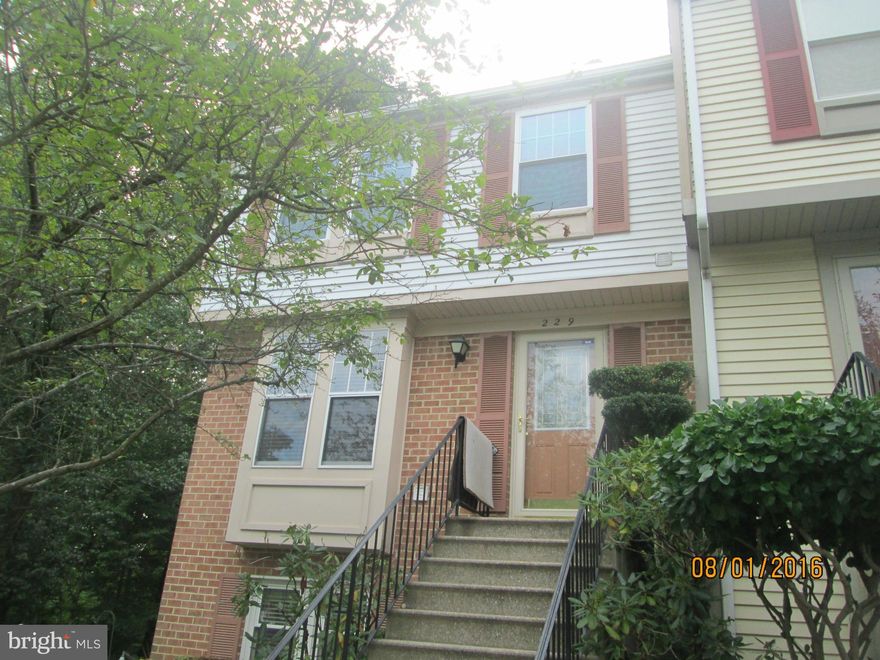 This lovely 2 bedroom and 1.5 bath condo has lots of character! It's has 2 level, partially brick end unit is very spacious w/beautiful hardwood floors,Full  size washer and dryer. It also features a wood burning fireplace and a large deck for entertaining your friends and family. DON'T MISS IT!!!