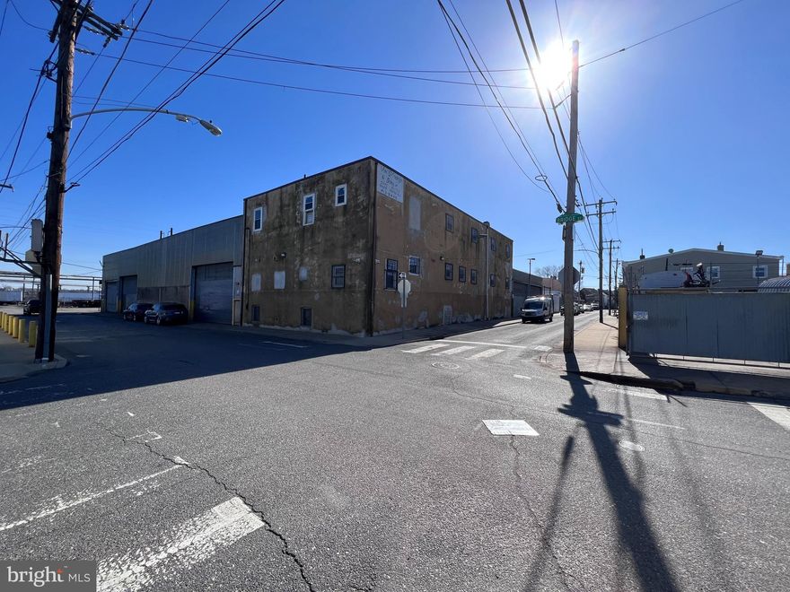 The property located at 2900-30 Bridge St in Philadelphia, PA, is a highly desirable warehouse with finished office space situated on a prime corner lot. This property boasts easy access to I95 and Delaware Avenue, making it an excellent location for businesses seeking accessibility and convenience. 

The property spans approximately 30,000 +/- square feet, offering ample space for a range of industrial, manufacturing, or logistics purposes. The building features a 26' ceiling height, making it perfect for high-capacity storage or large machinery.

Additionally, the property features five tailboard loading docks that can easily accommodate full-size tractor trailers, making it highly functional for businesses that require frequent shipping and receiving. Furthermore, the building has three roll-up doors along Bridge St. Two of these doors are 16' H x 25' W, while the third door is 13' H x 25' W, providing flexible access to the warehouse floor.

The property is further enhanced by two additional roll-up doors that give access from Gardner St. into a garage space, providing convenient options for storage or workspace. The building also features a 13,200-volt electric connection, along with access to public water and sewer systems.

The property's flexible ICMX zoning for all three parcels (2900, 2920, 2930) allows for a range of uses, including manufacturing, distribution, warehousing, and retail. This property's location adjacent to the planned extension of the Bridesburg North Trail and the Delaware Ave extension makes it an attractive investment opportunity, with the potential for future development or expansion. Overall, this property is an exceptional opportunity for businesses seeking a prime location, flexible zoning, and ample space for their operations.