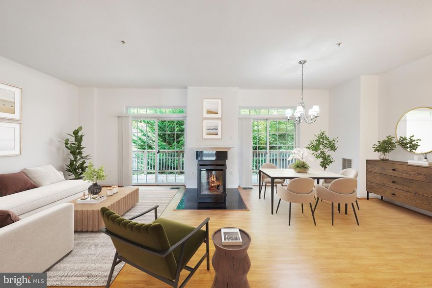 Step into this beautifully updated two-level condo, offering over 1,593 square feet of modern living space. Enjoy the convenience of a one-car garage and additional driveway parking, along with guest spaces available. The open-concept kitchen, featuring brand-new granite countertops and a breakfast bar, overlooks the spacious living and dining areas—perfect for entertaining. A double-sided gas fireplace adds warmth and charm, seamlessly dividing the living and dining rooms.

Relax on the covered back balcony, with dual access from both the living and dining areas, and enjoy serene views of the surrounding trees. The primary bedroom is a true retreat, complete with a private front balcony, 2 walk-in closets, and an updated en-suite bathroom featuring dual sinks, a walk-in shower, and a soaking tub.

Freshly painted throughout, this home is move-in ready with thoughtful updates, including a new vanity in the primary bathroom. Located close to I-495, Potomac Mills, shopping, dining, and commuter options, this condo offers the perfect blend of comfort, style, and convenience.