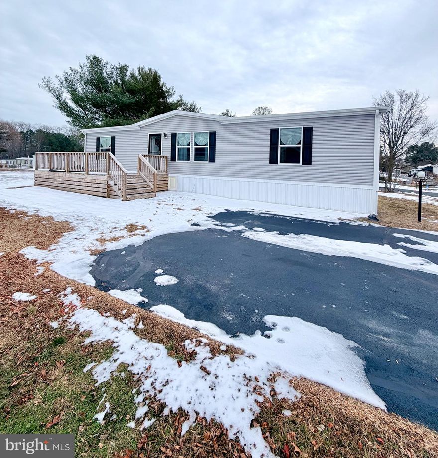 This charming and cozy three-year-old home offers easy, modern living in a well-designed 3-bedroom, 2-bath double wide. The open floor plan makes the space feel bright and welcoming, with the kitchen at the heart of the home. It opens seamlessly to both the breakfast area and living room, making it perfect for everyday living and casual entertaining.

The primary bedroom is thoughtfully located on one side of the home for added privacy and features two spacious closets along with its own private bathroom. On the opposite side, you’ll find two comfortable secondary bedrooms and a full bath they share.

Step outside and relax on the front porch /deck while enjoying morning sunrises or peaceful sunsets. This well-kept, nearly new home is move-in ready and waiting for you—schedule your tour today and come see it for yourself.