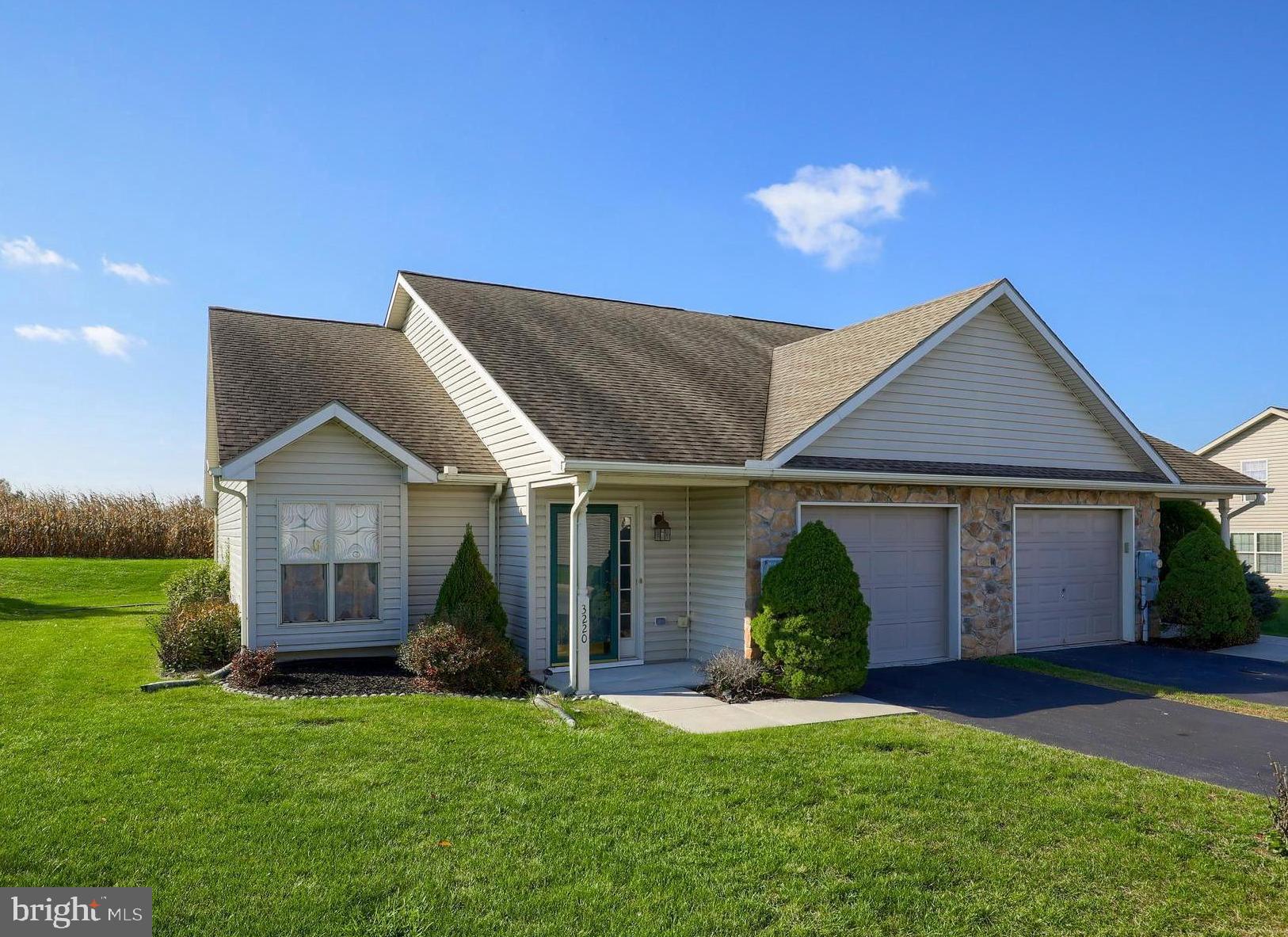 Wonderful home featuring 1st floor living at its best located in the private community of Wheatland. This end unit home backs up to farm land and offers a large living room with vaulted ceiling and a built in window seat. Bright and open kitchen with breakfast bar, pantry, oak cabinetry and laundry area. Separate dining room with sliding glass doors leading out the rear patio. Relaxing master bedroom with a 6 x 6 walk in closet and private bath. An additional bedroom and full bath can also be found on the main level. An opportunity to increase the finished living space can be found on the 2nd floor featuring a plumbed full bath with a tub and shower combo and an additional bedroom, all framed and ready for your finishing touches. Attached one car garage, covered front porch and conveniently located to Route 30, The Dover Township Community Center, shopping and restaurants. Call today to schedule your private tour!