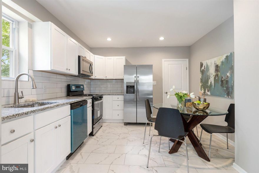 PRICE IMPROVEMENT!  A MUST SEE - Newly rehabbed home!  This 4BR 2 BA with Owner' suite on the 1st level  just finished a complete makeover including NEW Kitchen with granite and stainless steel appliances;  NEW Bathrooms with custom ceramic surrounds; NEW Flooring throughout;  NEW finished lower level; NEW Windows;  NEW Siding; NEW HVAC;   AND MUCH MORE!  Large rear yard for kids and entertaining! Don't miss this one!