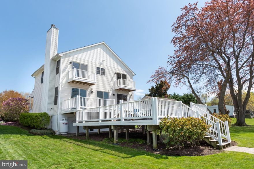 BRING YOUR DREAM TO LIFE!!!!  Living on water's edge,  beautiful coastal home spanning 2 levels with water views from almost every window,  the main floor is designed to suit all occasions from entertaining guests to relaxing after a day at work,  free flowing well-presented open plan living and dining  with wall to wall glass sliders capturing picture perfect views,  chef-friendly kitchen with breakfast bar   The upper level is dedicated to  4 bedrooms(2 with balcony's) and 2 baths - large master with private balcony,  cathedral ceiling and luxury master bath.  Outdoors you will find an expansive sun-dabbled double decker constructed with epay wood - perfect spot for summer BBQ's,  just steps away explore water's edge and take full advantage of the pier with 2 jet ski lifts, boat lift, fishing, crabbing, swimming, kayaking or just relax and catch a falling star.   Other highlights include hardwood floors,  tile flooring, new SS appliances, granite counter tops, master bath with soaking tub,  tons of storage in crawlspace (approx 6 ft ceiling & concrete floor),  irrigation system, attached garage and beautifully landscaped.  Daydreaming comes naturally in this place you could call home. Come and see for yourself and secure your own piece of paradise today.