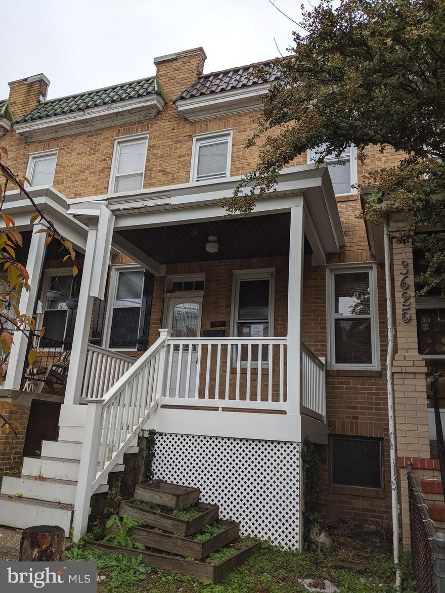 Porch-front home in the enclave of Woodberry in need of extensive renovations but has fantastic potential with wood floors, rear porch, skylight, full unfinished basement, attractive street. Home is sold strictly as-is and the seller will only consider cash or rehab loan offers. Buyer to pay all transfer and recordation taxes.  This home could be a real winner!