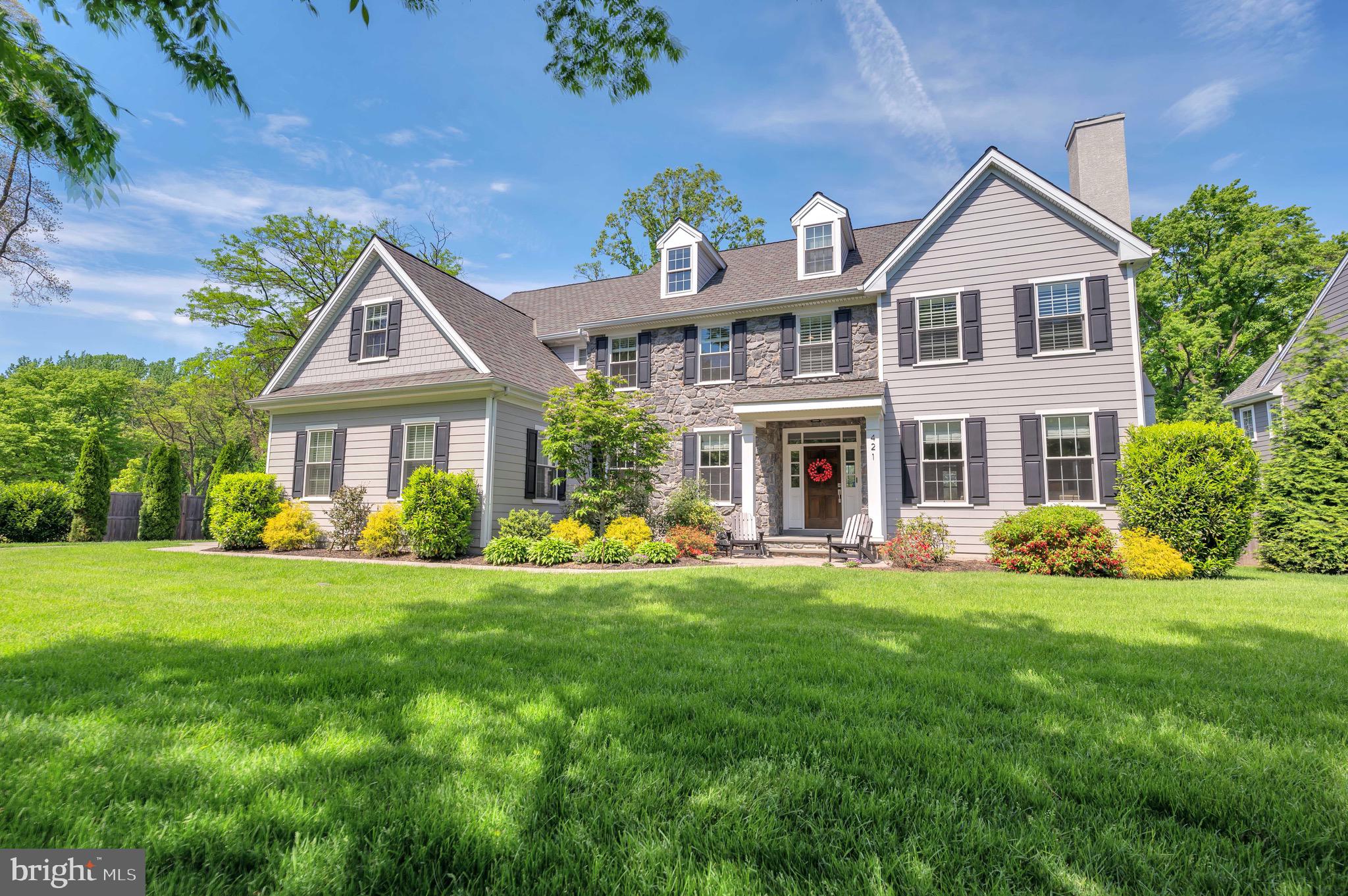 Welcome to a 2018 Stone Colonial that has gotten better with age! Many upgrades and improvements have been done to make this the home of your dreams. Entering the spacious foyer, the open floor plan is apparent with views into the living and dining rooms, the grand staircase and out the french doors to the private serene backyard. Throughout the first and second floors, there are hardwood floors, crown molding, large windows with custom window treatments, and an attention to detail in the finishes. In the back of the home, there is a private office (or a bedroom), a beautiful full bath and the heart of the home-the kitchen and family room. The kitchen boasts modern cabinetry, a large quartz island with seating for four, stunning light fixtures and Jenn-air Stainless appliances. The appliances include an oversized refrigerator/freezer, six burner gas cooktop, wall oven, microwave/convection oven and a stainless farm sink. The kitchen overlooks an eat-in area with skylights and a spacious family room with a gas fireplace, surround sound system, windows for lots of natural light and views of the expansive patio and fenced in yard. Adjoining the kitchen area is a mudroom with cubbies and closets, a powder room, a back staircase, a door into the two-car garage and exterior door to side of the home.
While the main level has an ideal floor plan for today’s family, the second floor will not disappoint. The Main bedroom suite is generous with two oversized walk-in closets (professionally designed and installed) and a bathroom that has it all. A walk-in rain shower, a free-standing soaking tub, double sinks with ample countertop space and a separate water closet. On the other side of the main stairway, the second bedroom has a door to a full bath with tub that also connects to the back hallway. The third bedroom is just off this hallway as well as the desirable laundry room with custom cabinetry and newer front-loading machines. The fourth and fifth bedrooms share a jack-and-jill bath that has a separate toilet and shower/tub room, so sharing can be private.
The lower level is finished to include multiple areas for entertainment, working out, a full bath and storage.
While the home’s interior is spectacular, the back yard is the piece de resistance! A new bluestone patio surrounded by lush plantings and solar lights, allows for a spacious entertaining around a built-in gas firepit and a jacuzzi. So luxurious!
This picture-perfect home is in the Top-Rated Lower Merion School District on a cul-de-sac within walking distance to Gladwyne Village and convenient to major roadways.
Schedule your private showing today. Showings begin on Saturday, June 4th.