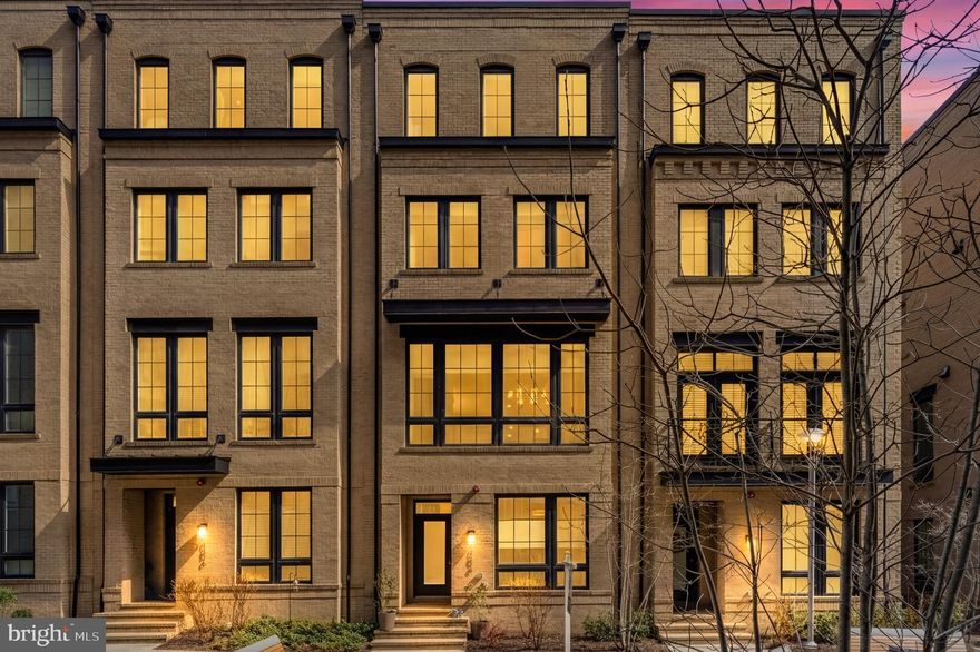 Welcome to this exceptional luxury townhome offering over 3,000 square feet of thoughtfully designed living space in one of Reston’s most sought-after locations. Rarely does a home come along that truly checks every box—combining a prime location, spacious and functional layout, and high-end finishes throughout. Unlike many newer townhomes, this residence offers a wider, more comfortable design with generously sized rooms across all four finished levels. Residents of Union Towns also have the option to enjoy premium amenities next door at Faraday Park, including a state-of-the-art fitness center and rooftop pool, for approximately $500 annually.

From the all-brick exterior to the beautifully appointed interior, this home impresses at every turn. Inside, you are welcomed by 9-foot ceilings and engineered hardwood flooring that extends throughout all four levels. The entry level features a versatile bedroom with an en-suite full bathroom, complete with a quartz vanity and floor-to-ceiling tile shower—ideal for guests, a home office, or private gym space. The spacious two-car garage is equally well-appointed with an epoxy-coated floor and EV charging outlet.

The main level is a true showstopper, featuring 10-foot ceilings and an open-concept layout designed for both everyday living and entertaining. The gourmet kitchen is equipped with shaker-style cabinetry, stainless steel appliances, quartz countertops, a tile backsplash, and an oversized island with a farmhouse sink. A custom beverage station with built-in cooler and quartz countertop adds both style and functionality. The family room is filled with natural light from expansive windows and opens directly to a private deck, perfect for outdoor dining or relaxing. A formal dining area and powder room complete this level.

Upstairs, the primary suite offers a spacious retreat with room for a king-sized bed, two walk-in closets with custom organizers, and a well-appointed bathroom featuring dual vanities with quartz countertops and a large walk-in shower with floor-to-ceiling tile. A secondary en-suite bedroom on this level provides additional comfort and privacy. The fourth level adds even more flexibility with a loft-style recreation space, an additional bedroom, and a full bathroom, along with access to a large rooftop terrace—perfect for enjoying the warmer months ahead.

The location is just as impressive as the home itself. Situated approximately 0.5 miles from the Wiehle-Reston East Metro Station, this home offers convenient access to the W&OD Trail, nearby parks, dining, and everyday conveniences, as well as close proximity to Lake Anne, Reston Town Center, Tysons Corner, the Dulles Toll Road, and Dulles International Airport. This is a rare opportunity to own a home that seamlessly blends space, location, and modern comfort in the heart of Reston.