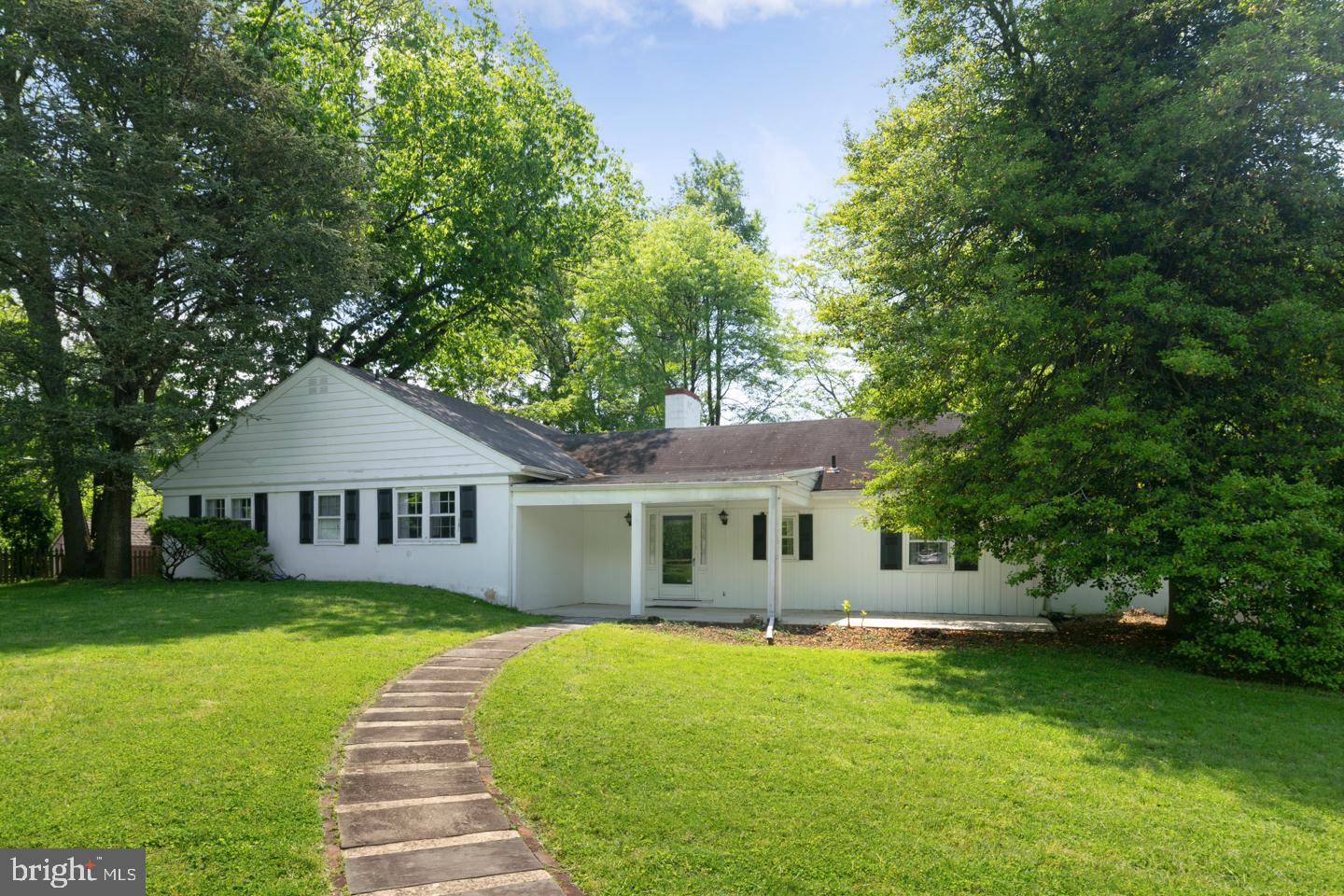 Opportunity to renovate and update this spacious multi-level home situated on 1.76 acres with over 2900 sq. ft. This home sits back from the street. There is a large backyard with a patio plus trees in the rear of the property for privacy. The 2 car attached garage has access into the home. Large open floor plan including a step down living room with a wood burning fireplace that opens to large dining room with a wall of built-ins for great storage. There is an outside entrance to the patio and backyard. The spacious eat-in Kitchen opens to a family room, laundry area and powder room. There is also a den with built-ins as you enter the home. The foyer has a powder room plus a coat closet.  The master bedroom has a tiled bathroom complete with a vanity with 2 sinks, There are 3 additional good sized bedrooms. The hall tiled bathroom has 2 sinks, stall shower and separate bathtub. Pull down attic stairs for additional storage. The heating system is less than 1 year old. Great closet space for storage. Fabulous location with easy access to Center City. Bring your creativity to create  the home of your dreams. This home is being sold in "as is" condition.