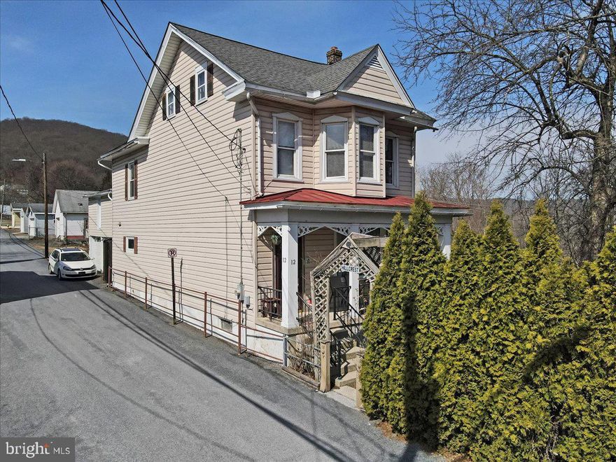 Be pleasantly surprised at this 1900 Century Historical Jim Thorpe Home, on a nicely landscaped lot. Within walking distance of Downtown, and just a short distance from Asa and Harry Packer Mansions. Home is immaculate with many unique features-- from ornate door hinges to working pocket doors and transoms. Gleaming wood floors, open staircase with original wood banister. Quality Kitchen cabinets and new appliances including washer and dryer. There are 4 bedrooms which are ambiance enhanced by small individual electric fireplaces. Home boasts 4 1/2 baths, a rear staircase and relaxing front porch. Off street parking in Jim Thorpe is premium. This certainly fits the bill with 3 parking spaces and 2 car garage.