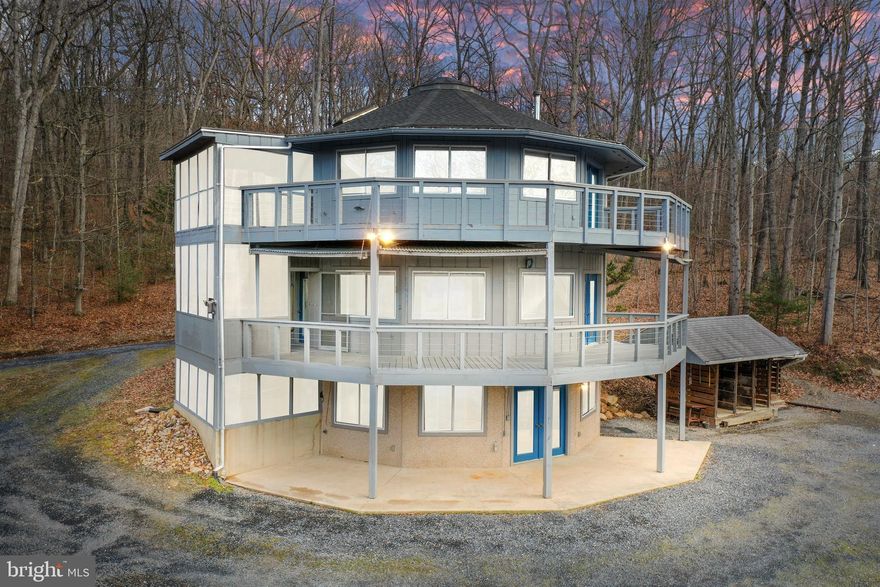 Private 8.9 Acre Shenandoah Valley Retreat with Valley Views.  Tucked into the scenic countryside of Mount Jackson, 308 Brush Leaf Lane offers a rare opportunity to own a private Shenandoah Valley retreat on 8.9 acres, with the option to purchase an additional adjoining parcel available exclusively to the buyer of the home. This distinctive round home blends architectural character with a setting designed for privacy, relaxation, and connection to the surrounding natural beauty.  Inside, the home features a light filled open living design with abundant windows that bring in natural light while framing panoramic Shenandoah Valley views. The circular layout creates an inviting flow throughout the living spaces.  Whether enjoyed as a full time residence or a weekend escape, the setting offers the quiet privacy and natural beauty buyers seek in the Shenandoah Valley.
Expansive wraparound decking extends the living space outdoors, perfect for morning coffee, evening sunsets, entertaining guests, or simply enjoying the peaceful surroundings. Wildlife is part of everyday life here, with deer, wild turkeys, and native birds frequently passing through the property.

PROPERTY HIGHLIGHTS
-Distinctive round home design.
-2 bedrooms, 2.5 baths.
-Open living areas filled with natural light.
-Expansive wraparound decking with valley views.
-8.9 private acres offering exceptional privacy.
-All electric is ran underground for safety and ease.
-Fiber Optic Broadband Internet.
-Deep well with delicious drinking water.
-20 feet round pond on property, perfect for animals!

VERSATILE OUTBUILDINGS
The property includes several useful structures providing flexibility for a variety of needs.
Detached garage for vehicles, equipment, or workshop space.
Storage building for tools and outdoor gear.
Separate office, hobby shop, or workshop building ideal for remote work, creative projects, or additional workspace.

ADDITIONAL LAND OPPORTUNITY 
Seller owns a separate 5.03 acre parcel across the road (See Photos) that may be purchased exclusively by the buyer of 308 Brush Leaf Lane for $79,000, well below the seller intended list price of $105,000. The parcel is not being offered independently, creating a unique opportunity for additional privacy, future building potential, or recreational use.

CONVENIENT SHENANDOAH VALLEY LOCATION 
Located just minutes from Bryce Resort, residents enjoy year round recreation including skiing, golf, mountain biking, and lake activities. The Shenandoah River and George Washington National Forest are nearby for fishing, kayaking, hiking, and exploring. Interstate 81 provides convenient access to Woodstock, Harrisonburg, and Winchester.

308 Brush Leaf Lane offers a rare combination of privacy, distinctive architecture, flexible land opportunity, and natural beauty, creating an ideal full time residence, weekend retreat, or Shenandoah Valley getaway.