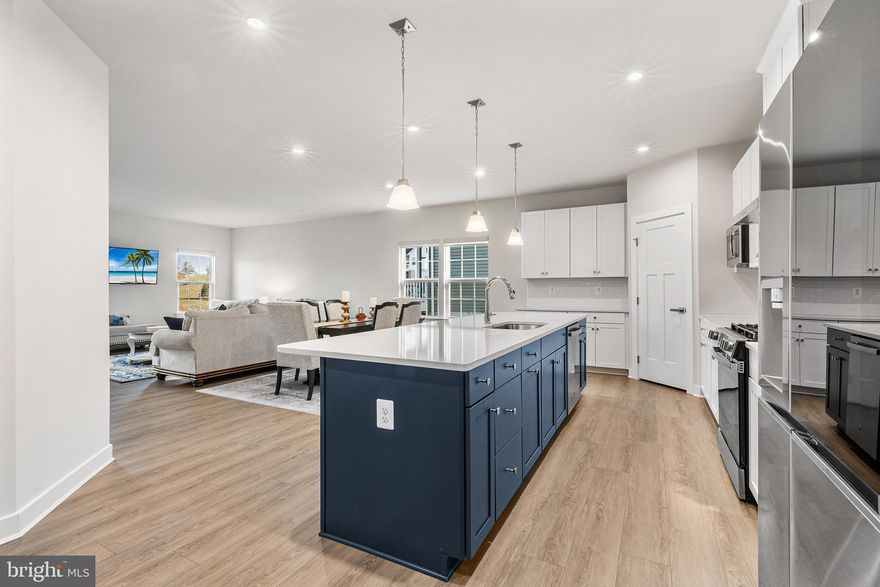 Why wait for new construction when you can have it all at 223 Letitia Drive Manor in West Grove.  Located just minutes from Jenners Village in the premier 55+ community of Big Elk this community offers a vibrant lifestyle  with planned resort-style amenities.  Enjoy the outdoor pool, fitness center,   and take advantage of all the resident activities at the beautiful clubhouse.  223 Letitia Manor Drive offers exceptional interior features which include an Open Concept Design that flows seamlessly, making it perfect for both quiet evenings and grand entertaining. The beautiful Gourmet Kitchen  serves as a centerpiece, complete with a stunning  9’ island/bar and high-end finishes such as quartz counters, custom cabinetry,  tile backsplash,  recessed lighting, pendant lighting , stainless steel appliances and coffee bar. The kitchen opens to the dining area which overlooks a spacious living/entertaining area with doors to the beautiful maintenance free private covered deck.  The luxurious Owner’s Suite offers a private sanctuary featuring a tray ceiling, and custom walk-in closet, and  includes a  spa-like bath with a Roman shower and double sink vanity. The main floor includes 2 additional bedrooms, one of which could serve as a flex room for an  office.  There is a  2nd full bath located in the hall. Beautiful high-end luxury plank flooring runs throughout the main living areas, providing both durability and style. An entrance to a 2-car garage completes the main level.  Enjoy expanded living space in the professionally finished lower level complete with Full Bathroom which offers a beautiful pallet for your specific living needs.. The community of Big Elk means more than just a beautiful home; again, it is a lifestyle. The Homeowners' Association provides low-maintenance living by handling lawn care and snow removal, allowing you more time to explore nearby parks like Goddard Park, local vineyards and shops of West Grove or spent the day in  Kennett Square and Longwood Gardens which is just a short drive away.  Easy access to Route 1 for your  commuting.  This is a stunning home in a beautiful community....schedule your tour today!