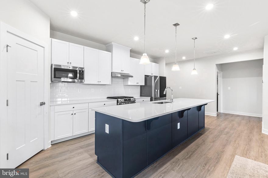 Discover the perfect blend of elegance and effortless living in this stunning, nearly-new Palladio Ranch model home located in the Premier 55+ Community of Big Elk in West Grove.  Built in 2024, this home offers a vibrant lifestyle with planned resort-style amenities including a clubhouse, fitness center, and outdoor pool. 223 Letitia Manor Drive offers exceptional interior features which include an Open Concept Design that flows seamlessly, making it perfect for both quiet evenings and grand entertaining. The Gourmet Kitchen and enhanced chef’s kitchen serves as a centerpiece, complete with a palatial 9’ island/bar and high-end finishes such as quartz counters, custom tile backsplash,  recessed lighting, pendant lighting , stainless steel appliances and coffee bar. The luxurious Owner’s Suite offers a private sanctuary featuring a tray ceiling, an custom walk-in closet, and a spa-like bath with a Roman shower and double sink vanity. In addition, there is a 2nd bedroom, office/optional 3rd bedroom as well as a full bath in the hall. Beautiful high-end luxury plank flooring runs throughout the main living areas, providing both durability and style. A spacious covered composite deck off the back of the home offers a great place to relax and unwind. Enjoy expanded living space in the professionally finished basement, ideal for a media room, office,  home gym, or guest suite, plus a 3rd full bathroom, offering a versatile space for every need. The community of Big Elk means more than just a beautiful home; again, it is a lifestyle. The Homeowners' Association provides low-maintenance living by handling lawn care and snow removal, allowing you more time to explore nearby parks like Goddard Park, local vineyards and shops of West Grove, as well as the many activities coordinated with fellow community members. Located within minutes of shopping and restaurants, as well as highway access to Route 1 for ease of commuting to Delaware or Kennett Square. Experience the finest in main-level living—schedule your tour of 223 Letitia Manor Drive today!