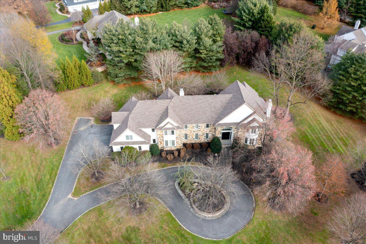 Elegant, estate home situated in the sought after neighborhood of Wickersham Estates & Unionville Chadds Ford School District just minutes from the county seat of West Chester. A circular driveway guides you to this beautiful home full of pleasant surprises. Transitional design w/open floor plan & plenty of natural light. Dramatic grand two story entrance foyer w/graceful winding staircase; gleaming hardwood floors beautiful architectural moldings & details, LR featuring a beautiful fireplace with marble surround, triple window & crown molding. Formal dining room with wainscoting, chair rail and crown molding. Family Room w/ two story ceiling and outstanding fieldstone fireplace. Custom Kitchen with handsome cherry cabinetry, granite countertops, tile backsplash, center island w/ gas cooktop, bar seating, sleek black appliances including Bosch dishwasher, dual built-in ovens, built in refrigerator and recessed lighting. Breakfast room w/unique octagonal coffered ceiling w/ skylights and wall of windows, adjoining sunroom opens to large patio; 1st floor office w/ french doors & gorgeous cherry built-ins serviced by a wet bar & formal powder room; back staircase. Garage entry mudroom with convenient full bath. 2nd floor boasts Generous hall overlooking the family room. Spacious MBR w/tray ceiling, double walk-in closets with built-ins & luxurious 5 piece tile bath including a corner tile shower, jetted tub, H/H vanities & water closet. 3 additional well appointed en-suite bedrooms. laundry room; walk-up finished 3rd level with ample storage. Gracefully finished walk-out lower level features a fabulous wine cellar, guest quarters w/ ensuite bath, exercise/media room, game room. The home sits on a gorgeous corner lot with extensive professional & mature landscaping and private back yard. Whole house generator. 2 zone HVAC. Seller offering a credit of $62,458.