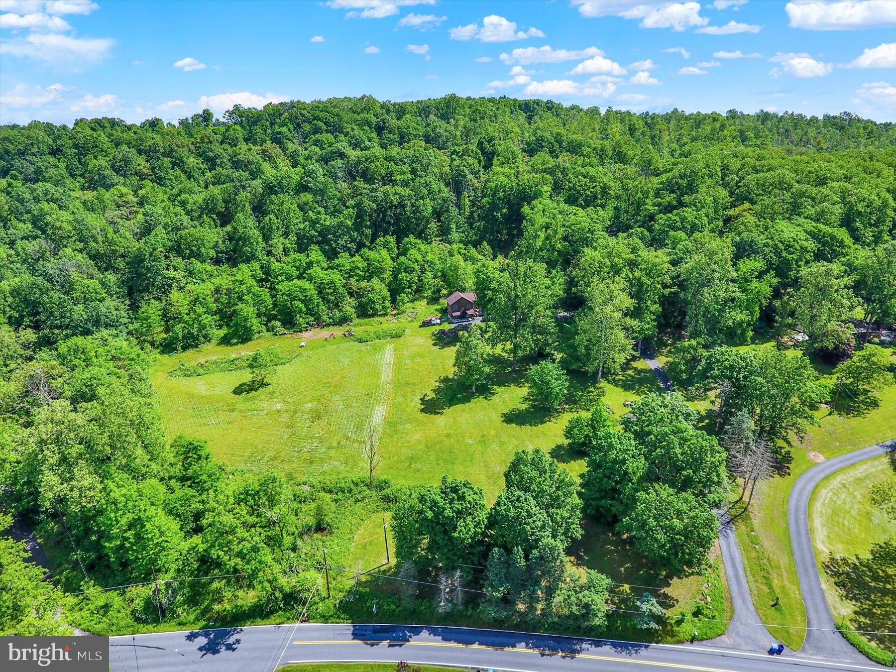 Located in a serene, wooded setting, this expansive 17+ acre lot presents a fantastic opportunity for building your dream home or investment property. Conveniently located just minutes from Route 83, you’ll enjoy easy access while still embracing the tranquility of nature. Whether you're looking to develop, create a private retreat, or take advantage of hard timbering potential, this property offers versatility and value. A rare chance to own a spacious parcel with natural beauty and strategic accessibility—don’t miss out!