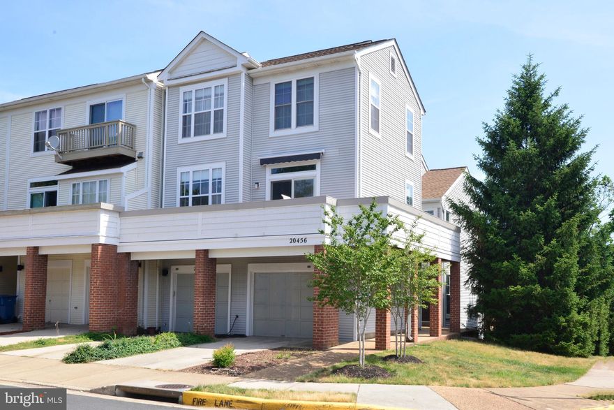 Fabulous 3-Level, 3-Bed Townhome for Rent Near Shopping and Pavilion Lake in Ashburn Village! This enviable end-unit townhome boasts bright and open living spaces, a big wraparound deck, and a Tesla  electrical charger in the garage. Recently repainted from top to bottom, the spacious interior displays newer tile in all bathrooms, beautiful dark hardwood floors, newer stainless appliances and light fixtures and much more! You’ll love the open floor plan, where living and dining blend seamlessly together. A cozy fireplace warms the space, and sliding glass doors open to the sunny deck with new Trex decking. The kitchen features granite countertops and great natural light. On the top level, the master suite and two secondary bedrooms each have hardwood floors and bright windows. Every convenience is at your fingertips, with a one-car garage, in-home laundry, and a great location near highways, shops and restaurants at Ashburn Village Center and One Loudoun. Residents at Ashburn Village enjoy top-notch amenities including Pavilion Lake just across the road, the expansive Ashburn VIllage Sports Pavilion, multiple swimming pools, playgrounds and more. Don’t miss this outstanding opportunity!