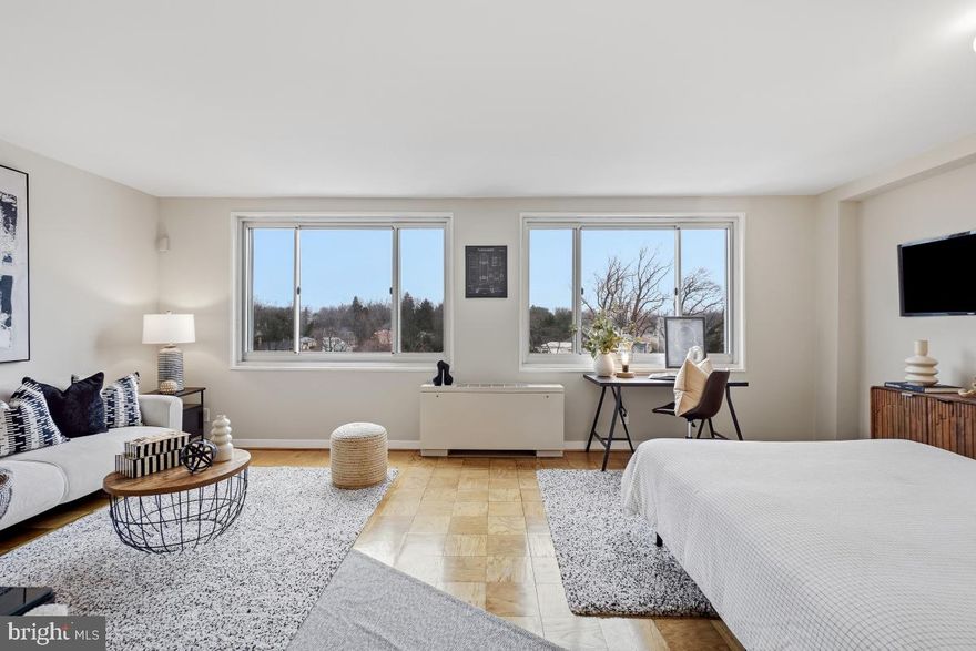 Floating high with sweeping panoramic views - this amazing and rarely available studio at Park Sutton has just been refreshed with good taste shining in all details. Beautiful and inspired in feel.  New white quartz countertop and white subway tile in the kitchen. New white bathroom - so pretty! Wall of huge windows and swathed in sunlight. Fee includes all utilities! Walk to Silver Spring Metro via tree lined streets.  Building has community feel with large lobby and comfy chairs, free parking, outdoor swimming pool with lifeguard and concierge. Situated near the future purple line and the future Capital Crescent bike path! Truly delightful! Open Saturday 1-3.