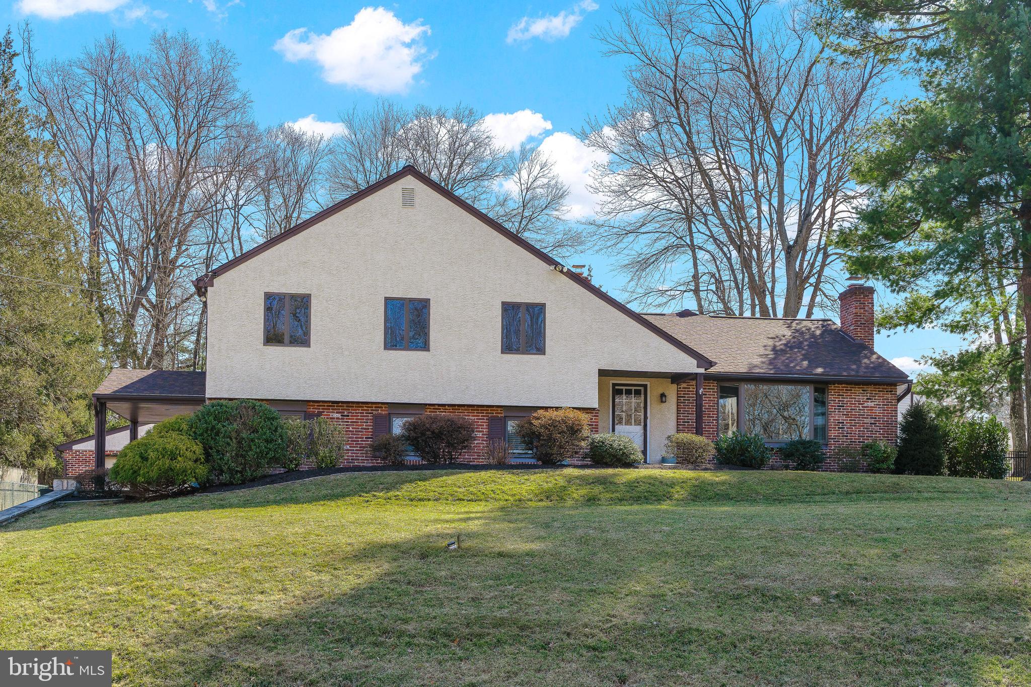 One of a kind split level, located in the Foxcroft Community within Marple Township. This 4 bed, 2 1/2  bath home has generous living space and is move in ready! The first floor contains a traditional layout, with dining and living room, each accented by hardwood flooring and crown molding. No detail goes unnoticed in the grand chef's kitchen. Beautifully built custom cabinetry with plenty of storage space, dual ovens, center island with range and additional sink. Gold toned vintage lighting fixtures hang from the ceiling, accented with rays of sunshine from the overhead skylights. Head over to the adjacent great room, where you can entertain friends and family throughout the seasons, especially with it's access to the private backyard. This room is not only impressive in size, but holds a magnificent wood burning fireplace, accented by a wall-to-wall stone mantel. The  vaulted ceiling and beams give height to the room yet create a warm and inviting feel. Upstairs, there are four bedrooms, including the main bedroom suite. The main bedroom includes plentiful closet space, and a luxurious bath, complete with glass stand up shower and modern vanity with fixtures. A wonderful feature of the home is it's additional in law suite, complete with a full kitchen, bath, and living area. This versatile space can also be used for any home office needs, as it has a separate entrance off the driveway. Enjoy nature at it's finest as you relax in the private backyard. Plenty of room to entertain, garden, play sports or simply sip a cocktail in the hot tub. You won't want to miss this fabulous house! Additional features include: oversized shed, detached two car garage, walk up attic for extra storage. Showings start Sunday, March 6th.
