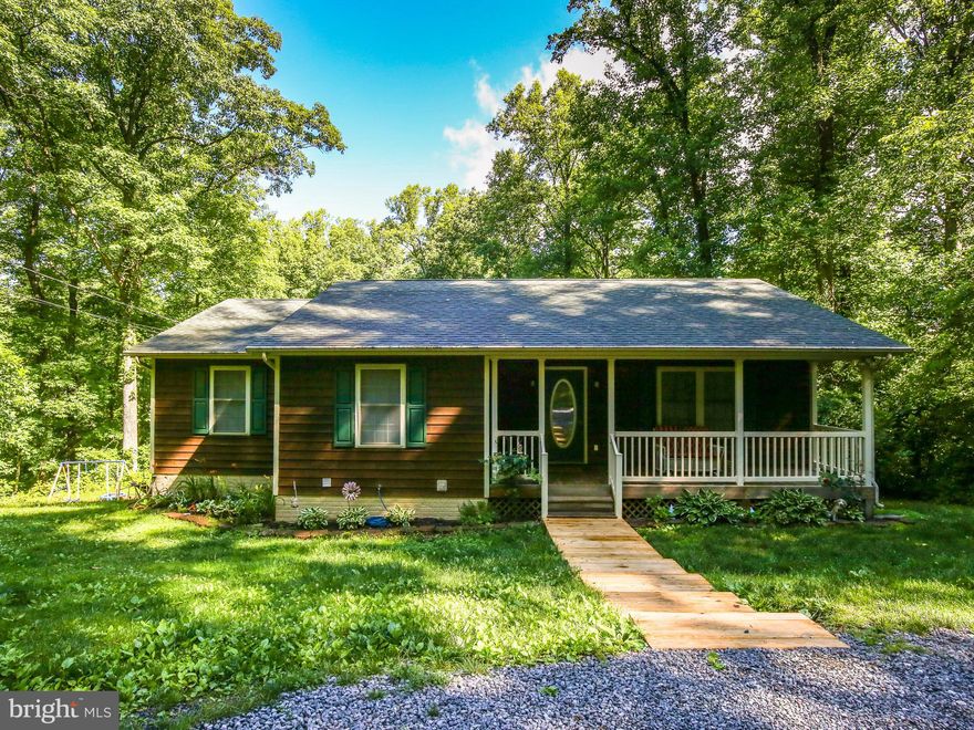 Charming cedar siding home situated within a beautiful mountain community. Conveniently located only minutes from I-66. Offering three bedrooms on the main level with an en-suite bathroom & a fully finished walkout basement! Enjoy the covered front porch and or the grilling deck leading to a spacious back yard. Out building conveys!
