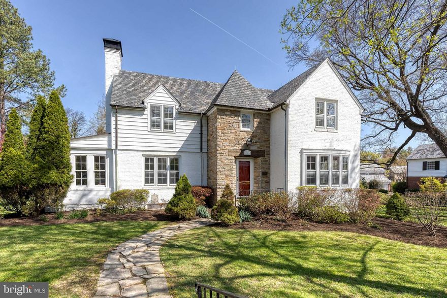 This exceptional Homeland residence stands out for its rare "triple lot"—a sprawling, half-acre-plus expanse of flat lawn and manicured gardens that is virtually unheard of in this neighborhood. Meticulously renovated, the home features a south-facing layout that bathes the interior in natural light, including a bright sunroom perfect for a quiet home office or den. The main level showcases gleaming hardwood floors and an open kitchen that flows effortlessly into the dining room. Upstairs, the second level offers four spacious bedrooms and two recently renovated full bathrooms. The living space extends outdoors to a private patio and downstairs to a finished basement. Complete with an attached garage and private driveway, this property offers a unique blend of massive outdoor scale and turnkey interior elegance.