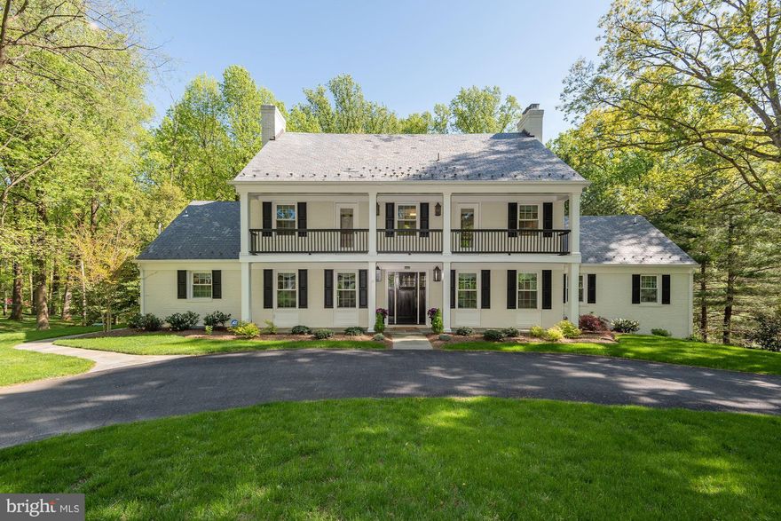 10850 Stanmore Drive is a wonderfully presented and classically stunning white brick Colonial in Potomac Falls. Situated on 2.13 lush acres, this 6 Bedroom, 5 Full Bath, and 2 Half Bath residence spans over 6,200 square feet of finished living space. Nestled near the banks of the Potomac River, Potomac Falls is an idyllic neighborhood that is only 1.5 miles to Potomac Village. Surrounded by parkland but yet with major commuter routes nearby, 10850 Stanmore Drive is ideally located to offer both privacy and convenience.   Steeped in timeless beauty, 10850 Stanmore Drive is breathtaking from the moment you turn onto the home’s circular driveway and past the brick entryway, looking onto the gracious facade with a sweeping upper balcony. Completely renovated in 2019, this 4-level expanded Colonial was re-imagined with an open floor plan and designer finishes throughout, plus comprehensive updates such as new wiring, plumbing, windows, and ductwork. Since then, this property has been meticulously maintained and showcases gleaming hardwoods, generous living spaces and timeless modern finishes. Mature trees line the sun-drenched, south-facing lot that has more than enough room for a pool, tennis or garden oasis.   The Foyer is bright and welcoming and boasts wide entryways to the principal rooms. The open Living/Dining Room fills the entire width of the home and is warmed by a fireplace with a marble surround. The stunning Great Room or Office has walls of windows and is adjacent to the Living/Dining Room with a separate entrance. On the other side of the Foyer is a Sitting Room that leads into the stylish and exquisitely designed Gourmet Kitchen. Complete with Viking appliances, gleaming countertops, a marble backsplash, an oversized Center Island and a Breakfast Area, this Kitchen is ready to impress a Chef of any caliber. The Family Room has a fireplace and is adorned with a vaulted and beamed ceiling. The sunny Deck has relaxing views of the lush and tranquil grounds.   There are 5 Bedrooms and 4 Full Baths on the two Upper Levels, including a gorgeous Primary Suite that features a large walk-through closet that leads to the spa-like Bath. A free-standing tub is the centerpiece of the Primary Bath and along with it the frameless glass shower, dual vanity, and marble floors make for a luxurious space. The 2 secondary bedrooms on the First Upper Level have private baths. There are 2 Bedrooms and 1 Full Bath on the Second Upper Level.   With nearly 1,700 square feet of entertaining area, the Lower Level is an excellent space for a number of activities. The expansive Recreation Room has a fireplace and walkout access to the backyard. There is a 6th Bedroom, Full Bath, Powder Room, Storage, and handsome Laundry/Mud Room with access to the attached Garage and rear yard.