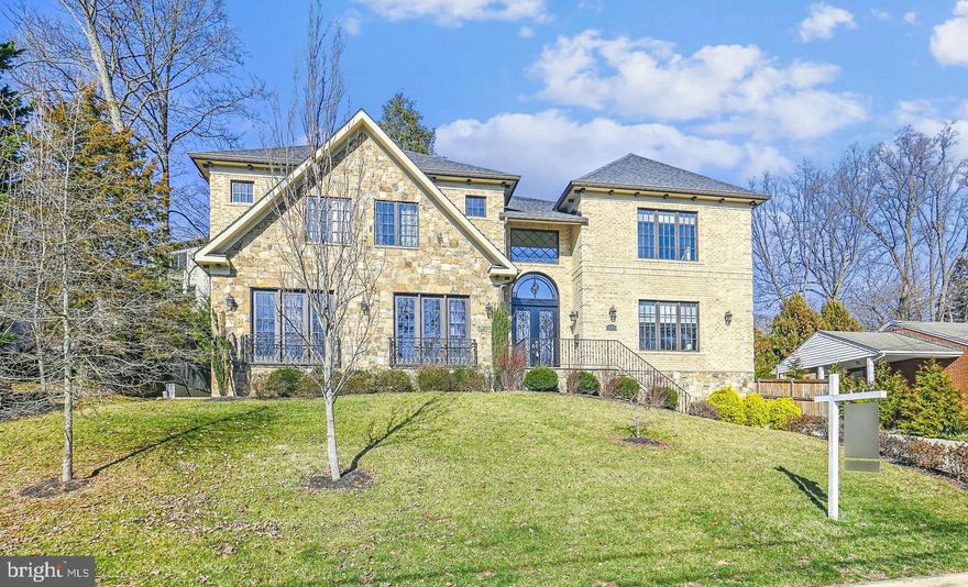 Introducing an elegant stone and brick home in highly the desirable Salona Village. Constructed by Saturn Partnership, they created a timeless luxury home with thoughtful finishes throughout. Premium millwork, stunning lighting fixtures, the finest imported tile, custom cabinetry, elegant extras and a lay-out that is both unique, functional and very comfortable for everyday living as well as entertaining. The home is nicely sited on a slight hill for privacy. As you walk through the stunning Italian-style iron doors into the entrance foyer, you are immediately impressed with the abundance of natural light. Handcrafted iron railings set apart the spaces as you immediately realize the home special. Gorgeous wide plank hardwood floors and Coffered ceilings with mood lighting.. The main level study offers a full bath and walk in closet- doubling as a main level bedroom blanketed in sunlight. Formal Dining Room opens to a Sun-filled Living Room. An open-concept Family Room with coffered ceiling and a beautiful stone fireplace. The Gourmet kitchen is well appointed with numerous high end Thermador appliances surrounding a large center island. The Breakfast Room has handsome built-ins and french doors that open to the private patio area. Adjoining the kitchen is a spacious Mud Room, walk in pantry and 3-car side load Garage offering an EV charging station. The luxurious Primary Suite has a Proper Sitting Room, double-sided Gas Fireplace, Coffee Bar and an Owner’s Bath and dual Walk-in Closets.. The lower level has Beautiful Recreation Room, a two-sided custom Wet Bar for gathering with friends, Wine Room, Fitness Room/Bedroom, Theater room and large Bedroom Suite. . Salona Village is very close to numerous parks, walkable to Balducci’s gourmet market. Nearby downtown Mclean and Tysons and Public elementary school within less than a half mile- and all the wonderful McLean shops and restaurants. It's just blocks away from the CIA, and is a quick commute to to Tysons Corner, Arlington, Washington DC and two major Airports!