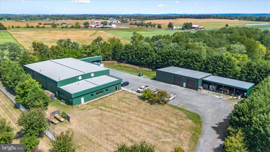 2.25 Acre property located with easy access to major transportation routes that connect Virginia, MD, WV, PA, and Washington DC. Zoned LI- Limited Industrial.  Current building offers an estimated 2630sq ft of office space that currently has 6 offices, a conference room, store space, reception area, storage and restrooms. The attached insulated warehouse is an estimated 9,861 sq ft with four garage bays.  One bay allows forklift access to the loading doc.  Loading doc with ramp: 1,031 sq ft. 
The separate, detached insulated warehouse is an estimated 3534 sq ft. with an attached run in shed that includes 4 large bays with a total sq ft of 2103. 
Parking lot currently has 12 car spaces and plenty of space to store large equipment or trucks. 
600 Amp service set up in the property.