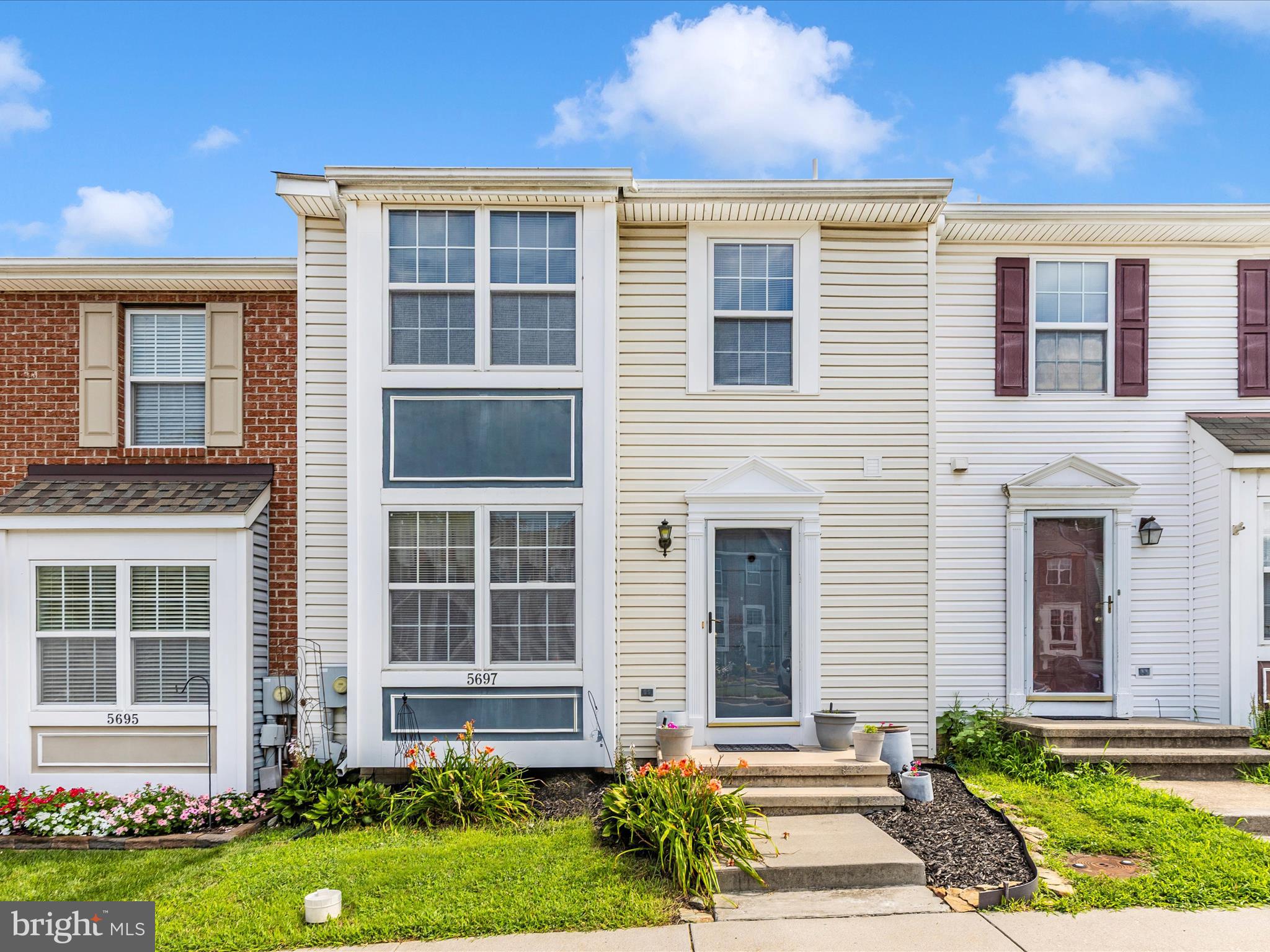 Welcome to this lovely interior townhome in the New Market West community! This well-maintained home offers a bright and functional layout, starting with a sunny kitchen, welcoming foyer, and convenient half bath on the main level. The spacious dining area flows seamlessly into the comfortable living room, which opens to a private deck—perfect for relaxing or entertaining. Upstairs, you’ll find a spacious primary suite featuring a walk-in closet and private bath, along with two additional bedrooms and a full guest bath. The finished lower level provides a large family room with a cozy gas fireplace and walkout access to the rear yard, plus a second half bath and a laundry room with ample storage space. Enjoy the peaceful setting backing to woods, with two assigned parking spaces conveniently located right out front. HVAC was replaced 2017 and the roof was replaced in 2006. Located close to commuter routes, this home combines comfort and convenience—don’t miss your chance to make it yours!