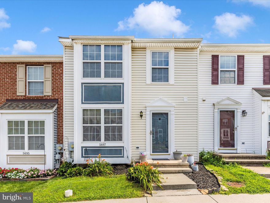 Welcome to this lovely interior townhome in the New Market West community! This well-maintained home offers a bright and functional layout, starting with a sunny kitchen, welcoming foyer, and convenient half bath on the main level. The spacious dining area flows seamlessly into the comfortable living room, which opens to a private deck—perfect for relaxing or entertaining. Upstairs, you’ll find a spacious primary suite featuring a walk-in closet and private bath, along with two additional bedrooms and a full guest bath. The finished lower level provides a large family room with a cozy gas fireplace and walkout access to the rear yard, plus a second half bath and a laundry room with ample storage space. Enjoy the peaceful setting backing to woods, with two assigned parking spaces conveniently located right out front.  HVAC was replaced 2017 and the roof was replaced in 2006. Located close to commuter routes, this home combines comfort and convenience—don’t miss your chance to make it yours!