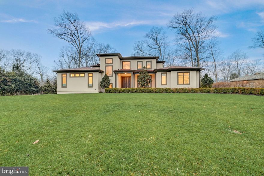 Discover the epitome of luxury living in this stunning, custom-designed masterpiece built by Castlewood Custom Builders in 2018 and boasting over 7,800 sq ft across three meticulously finished levels. Nestled on a private 0.6-acre lot within a tranquil cul-de-sac street, this architectural gem offers a perfect blend of sophistication, comfort, and practicality. Boasting 10-foot ceilings on the first floor, 8-ft doors, and Pella windows with built-in shades (architect series in common areas and designer series in bedrooms), luxurious finishes abound throughout the home. From the designer front door to the stucco exterior and screened rear porch, every detail of this home reflects careful craftsmanship and attention to detail. Spanning three levels, the practical and spacious floor plan accommodates your changing needs and has a great flow for entertaining.  The impressive two-story foyer sets the stage for the elegant living spaces to come. The main level features a formal dining room with a bright picture window. The gourmet kitchen features high-end Sub-Zero and Wolf appliances, an oversized center island with a waterfall edge, quartz countertops, and custom cabinetry. A butler's pantry with a wine refrigerator and a extra dishwasher adds convenience to your culinary experience. The breakfast area is open to the kitchen and has direct access to the large screened in porch, and direct access to the backyard, featuring mature trees and new landscaping, including a rain garden and green giant trees that boarder the property, creating a serene and private outdoor oasis. Inside, the spacious living room, adjacent to the kitchen, features pocket doors that provide flexibility for an open floor  or added privacy. The living room boasts a gas fireplace, tray ceiling with up-lighting, and floor-to-ceiling windows with picturesque views of the garden. Completing the main level are 2 bedrooms, including the primary bedroom and en-suite bathroom with dual walk-in closets, an office, a mudroom with laundry, pantry, and access to a 2-car garage. The second floor features four bedroom rooms and three bathrooms, including a buddy bath. The walk-out lower level is a haven for entertainment and features a media room, bedroom, full bathroom, exercise room, and a sizable unfinished space featuring epoxy-painted floors for added durability and low-maintenance elegance that can be finished into any space you could want or need. The home also boasts eco-friendly features such as a water purification system and bidets on all toilet seats, with four of them heated, and smart light switches, which provide convenience and energy efficiency. Completing this impressive home is a generator, Carrier HVAC units, air purifier, and a security camera system to ensure safety and comfort. EXCELLENT LOCATION Situated between 3 country clubs (Bethesda, Congressional and Burning Tree) and a stone's throw to the Cabin John Trailhead, this home is surrounded by nature yet nearby to the best of city living! Nearby to Cabin John, Potomac, Bethesda, Chevy Chase and Washington DC for premium shopping, dining and entertainment. For your everyday needs, you're a few short minutes to Balducci's Market, Giant Food Grocery Store, and Westfield Montgomery Mall. Nearby to major employers (Amazon, Gannett, Capital One, Freddie Mac, Northrop Grumman, Federal Government, to name a few) and hospitals (Suburban Hospital, Walter Reed Medical Center, and NIH Clinical Center). EASY COMMUTE The bus stop is at the entrance of the community and you're nearby to major commuter routes (River Road, Bradley Blvd, I-495, I-270 Spur).
Embark on a new chapter of refined living in this exceptional home, where every detail has been meticulously curated to offer unparalleled comfort and style. Welcome Home!