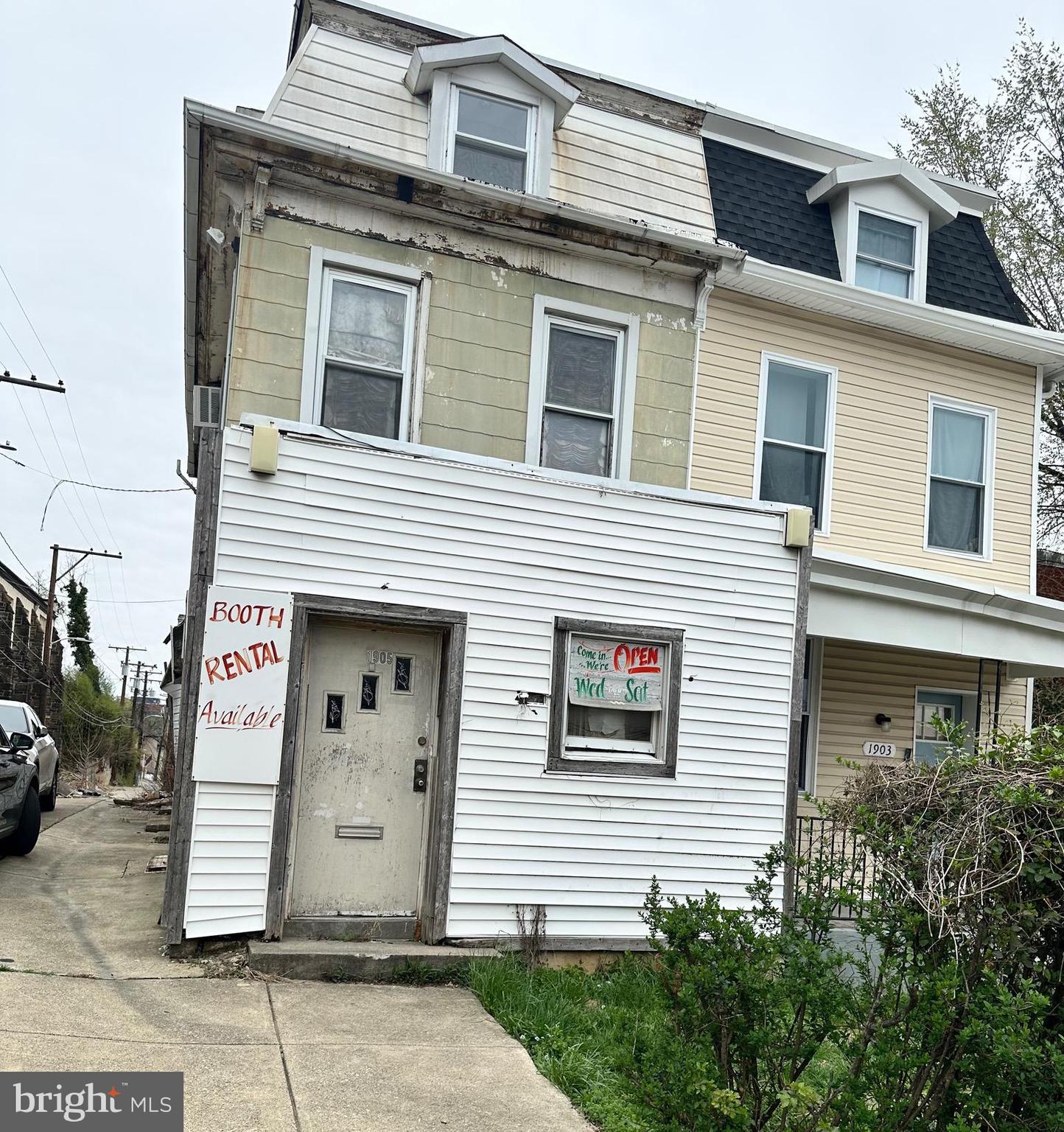 Investor special! Previously used as a salon and barbershop, with two upper level living areas. This is a end unit 4 level townhome with 3 bedrooms and 2 half baths! Bring your vision and talent to bring this property back to life!