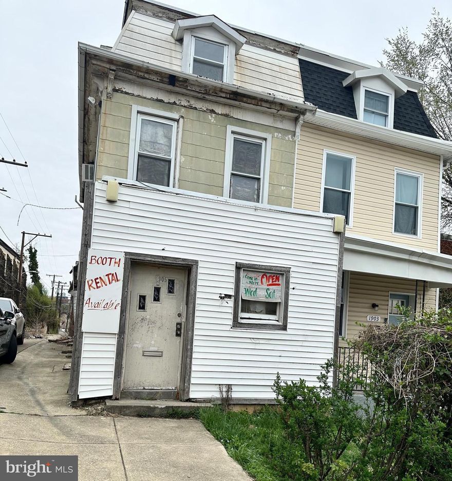 Investor special! Previously used as a salon and barbershop, with two upper level living areas. This is a end unit 4 level townhome with 3 bedrooms and 2 half baths! Bring your vision and talent to bring this property back to life!
