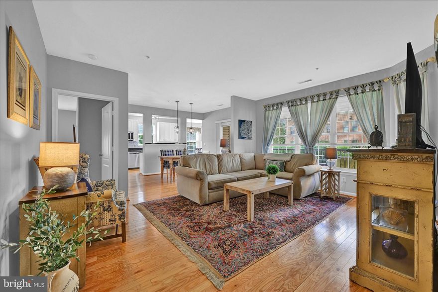 Rarely available three-bedroom condo in Hunt Valley's luxury High View community! This unit offers an elevated feeling of space with an impeccable interior design aesthetic and upscale finishes, plus two deeded parking spaces conveniently located very close to the unit! The open concept floor plan connects the living room, dining room, and kitchen. Beautiful hardwood floors and neutral décor exude warmth and appeal. The kitchen offers 42-inch white cabinetry and features all your design must-haves: subway tile backsplash, granite counters, stainless-steel appliances, and a pantry. The adjoining light-filled breakfast room features additional cabinetry and a beverage station / planning desk with granite countertops. The dining room is perfect for intimate dinners and opens to the covered patio which overlooks the serene courtyard. Retreat to the primary suite with adjoining flex space that can be utilized as a dressing room, sitting room, or office. The large primary bath offers a soaking tub and separate shower with two vanities and two walk-in closets. The second and third bedrooms feature spacious closets and share the ample second bath. Don't miss the laundry with shelving for added storage! Enjoy the ultimate in resort lifestyle amenities with concierge service, outdoor pool, fitness center, tennis courts, movie theater, café, meeting room, library, card room, and office space. The entertainment options are endless! Elevator building with covered garage parking, conveniently located just minutes from Hunt Valley shopping, entertainment, and recreation with easy access to I-83 and I-695.