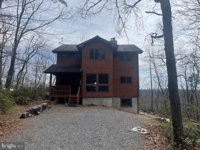Very nice secluded cabin in the expansive gated community of The Preserve at New Creek. This 4 bedroom, 3.5 bath is a mixture of rustic, tranquil and modern architecture. The main living level has an inviting foyer, dining room, half bath, bedroom and a large modern well equipped kitchen with a wooden top center Island and stainless steel appliances. The kitchen opens up to a stunning, picturesque living room with a large natural-stone wood burning fireplace for cold winter nights. The floor to ceiling windows offers an panoramic view of the mountains. There is access to the large deck from the living room and kitchen. Ascend the stairs to the 2nd. level where you will find an office nook, primary bedroom with an en suite bathroom with large shower and double vanities. There is also 2 additional spacious bedrooms with a shared bath. Main & 2nd. levels have hardwoods floors & tiled bathrooms. The large lower level has a fun rec room that has 2 sets of bunk beds, and a full bathroom. Lower level also has three separate storage areas and access to the outside. The house sleeps 12, making it perfect for a weekend getaway or full time living. The community consists of 1,000 acres in the Alleghenies. 500 acres are protected conservation land with maintained hiking trails. the house is located less than 3 hours from DC and less than an hour to the ski slopes of the Canaan valley and fishing & kayaking in the South Branch River. Internet access through Starlink Satellite service.