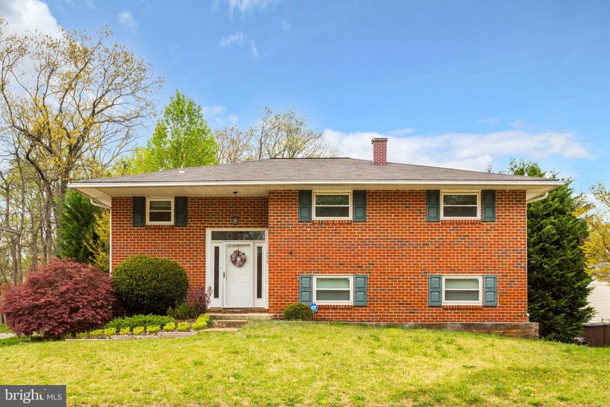 Discover your dream home in this spacious and well-maintained brick split foyer.  The upper level boasts three cozy bedrooms, a full bathroom with double vanity sinks, and beautiful hardwood flooring.  The modern kitchen is fully equipped with updated appliances and opens to the dining room, which leads to a lovely deck - the perfect place for entertaining guests. The living room features a bay window, letting in lots of natural light, and overlooks the backyard. The lower level is equally impressive, with a fourth bedroom, a second full bathroom, a huge family room/rec room, and ample storage space. The lower level also has a walk-out to the patio and a fully fenced backyard. The yard backs to trees, providing a peaceful and private setting for you to unwind and relax in the hot tub. This house has everything you need and is conveniently located near commuting routes, shopping, and dining. Don't miss out on the opportunity to make it your own!