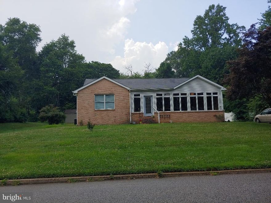 ** Back on the Market ** This all Brick rancher (4 brick sides), 3 Bedroom 2 bath home  boost beautiful hardwood floors. Large rooms with zoned hot water base board heat. Enjoy the additional warmth from the gas fireplace ,  Sun-room also has heat and air conditioning for year round usage. Kitchen has tiled floors plenty of room to entertain and cook , new oven, and microwave, slider opens to back yard, new hot water heater.  Master bedroom has a large walk-in closet, private bath hardwood floors. Additional 2 bedrooms have large closets and hardwood floors. First floor laundry. Pull down stairs for easy attic access. Nice large open full basement ready to be finished to meet your needs. Level back yard with circle driveway leads to 2 car garage,  plenty of yard for out door entertaining. All of this on over 1/3 of an acre.