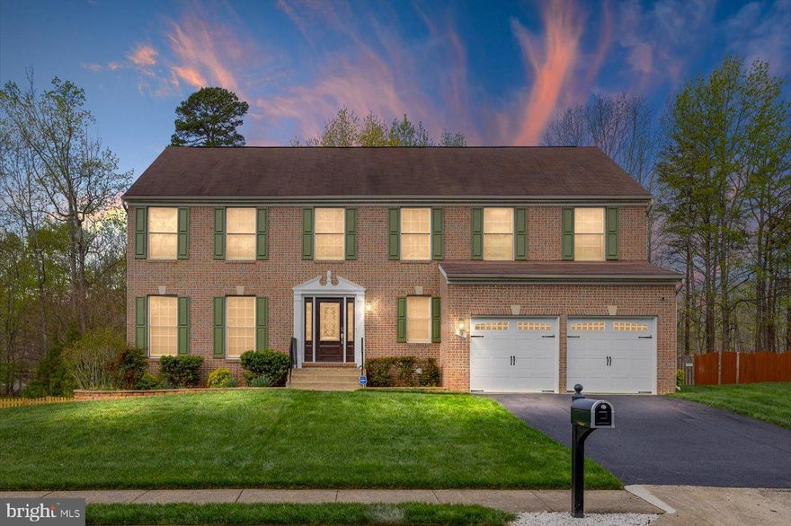 Move-in-ready home in a quiet cul-de-sac in the sought-after Austin Ridge community, this stunning Colonial is ready for its new owner. The elegant brick-front exterior adds timeless curb appeal, while the inviting two-story foyer welcomes you inside. Just off the entryway, you’ll find a convenient powder room and a staircase leading to the bedroom level. Designed with a classic layout, this home offers both a formal living room and a dining room, perfect for entertaining. The gourmet kitchen boasts crisp white cabinetry, sleek black granite countertops, and a seamless flow into the spacious family room, complete with a cozy gas fireplace. Upstairs, you’ll find four generously sized bedrooms, including an expansive primary suite featuring a vaulted ceiling, a luxurious ensuite bath with dual vanities, a soaking tub, and a separate shower. The unfinished basement, equipped with rough-in plumbing, provides ample storage and the potential for future expansion. A large attached two-car garage and recently repaved driveway offer plenty of parking. Enjoy outdoor living on the Trex deck overlooking the fully fenced backyard—an ideal space for relaxation or gatherings. Recent updates include a new water heater (2020), HVAC system (2020), and water softener (2024). Don’t miss this exceptional opportunity—schedule your showing today!  An open house will be held on Saturday 4/12 from 12-3pm.  Call your agent for a tour today!