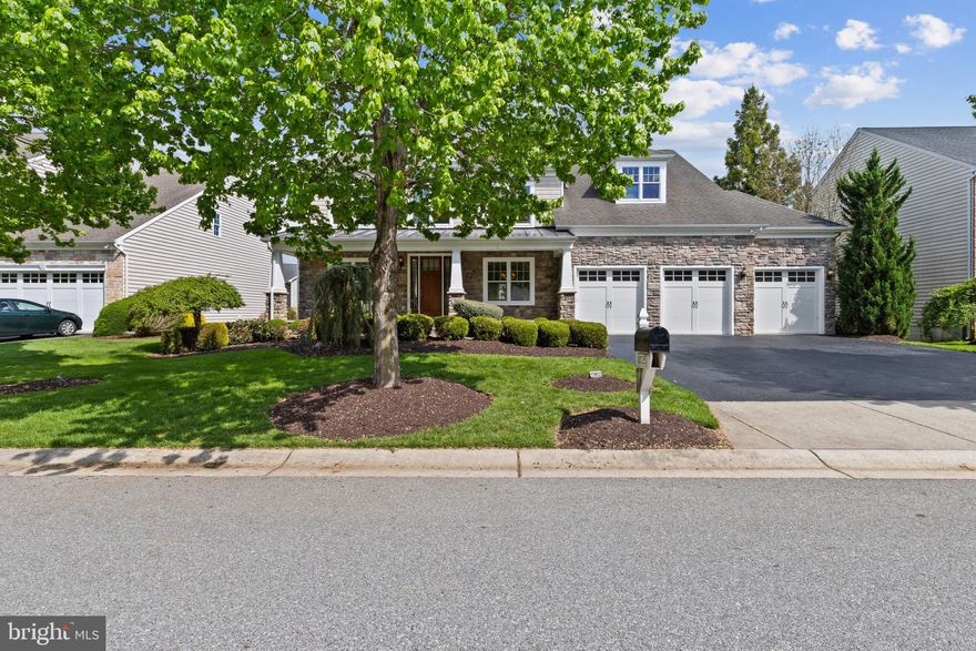 Spanning an impressive 6,264 finished square feet, this exceptional residence in Taylor Farm showcases timeless elegance paired with modern comfort. Rich hardwood floors extend throughout the main level, complementing a traditional yet open-concept design enhanced by a warm, neutral color palette and refined architectural details, including graceful columns. // A grand foyer sets the tone, opening to a formal living room highlighted by beautiful bay-style architecture and abundant natural light. The sophisticated dining room features classic wainscoting and a striking chandelier, creating the perfect setting for elegant entertaining. Nearby, a private study with detailed millwork and French doors offers a quiet retreat, while two powder rooms add convenience. The spacious family room invites relaxation with its coffered ceilings and a stunning stone-accented gas fireplace. // An arched doorway leads to the gourmet eat-in kitchen, thoughtfully designed for both everyday living and hosting. Enjoy granite countertops, a generous center island, stainless steel appliances including double ovens, and a walk-in pantry. A butler’s pantry with built-in wine storage and a beverage refrigerator adds a touch of luxury. A breakfast bar overflows into a sunlit morning room with sliding door access to the backyard, creating a bright and airy atmosphere. // Upstairs, the home offers four generously sized, carpeted bedrooms, each with its own private bathroom and walk-in closet, along with a well-appointed laundry room. The luxurious primary suite is a true sanctuary, featuring a raised sleeping area framed by palladium windows, a private balcony, and a sitting room complete with a built-in wet bar. The spa-inspired en-suite bath boasts a soaking tub, a separate shower with dual showerheads, dual vanities, and access to an expansive walk-in closet with custom organization. // Designed with entertaining in mind, the fully finished walk-out lower level provides exceptional versatility. This expansive space includes multiple areas for recreation, gaming, and dining, along with a convenient kitchenette and breakfast bar. Enjoy movie nights in the tiered home theater, and take advantage of a fifth bedroom, a full bathroom, and ample storage and utility space. // The outdoor living spaces are inviting and low-maintenance, highlighted by an expansive Trex® deck and a covered paver patio framed by mature landscaping. Overlooking a serene, open backyard, the setting offers multiple areas to relax, gather, and enjoy the peaceful surroundings in privacy. // Taylor Farm is a sought-after community in Woodstock, Maryland, known for its cohesive streetscapes, spacious single-family homes, and tranquil residential character within Howard County.