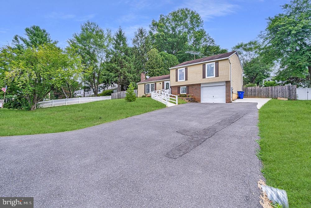 This property qualifies for USDA 100% financing!! Welcome to 7103 Unakite Ct — a spacious and updated split-level home in the heart of Middletown, offering flexible living across four finished levels and a fully fenced backyard that’s perfect for entertaining or relaxing.
As you step inside, you're greeted by LVP flooring that flows throughout the entire home, providing a warm, modern look. The main level features a sunlit living room, dining area, and a stylish kitchen with stainless steel appliances — the perfect setting for everyday living or hosting guests.
Upstairs, you'll find three generously sized bedrooms and two renovated full bathrooms, including a primary suite with its own private bath.
The first lower level offers a versatile space with a built-in desk, ideal for a home office, TV room, playroom, or casual family hangout. This level also includes interior access to the garage.
Continue to the second lower level, where you'll find a large bonus room that can serve as a den, or home gym — complete with a 3rd full bathroom.
A standout feature of this home is its expansive fully fenced backyard, offering privacy and room to play, garden, or unwind on the deck.
The home was previously outfitted for a small in-home daycare, so you’ll notice unique features like a stairlift, exit signage, and visible emergency piping installed to meet fire marshal requirements. The sellers are open to leaving these items for continued business use or removing them and restoring the walls to their original condition — whichever suits your needs best.
Set on a quiet cul-de-sac in a desirable neighborhood, 7103 Unakite Ct is move-in ready and offers incredible flexibility for today’s lifestyles.