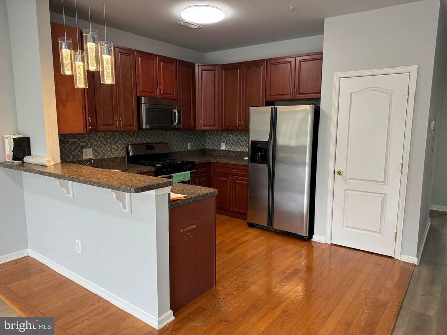 Byberry Station Luxury Condos, Rarely offered 2nd floor unit. 9'+ ceilings, energy efficient windows, 2 story unit with balcony, featuring wood flooring and carpeting. Tiled floor with 42" cabinets, large pantry closet, granite counter tops with breakfast bar in kitchen, dishwasher, garbage disposal, refrigerator, microwave, laundry area (W/D). Ceiling fans in bedrooms, living room and 2nd floor great room.  Large 2nd floor great room with storage space. Close proximity to rail and highway access.