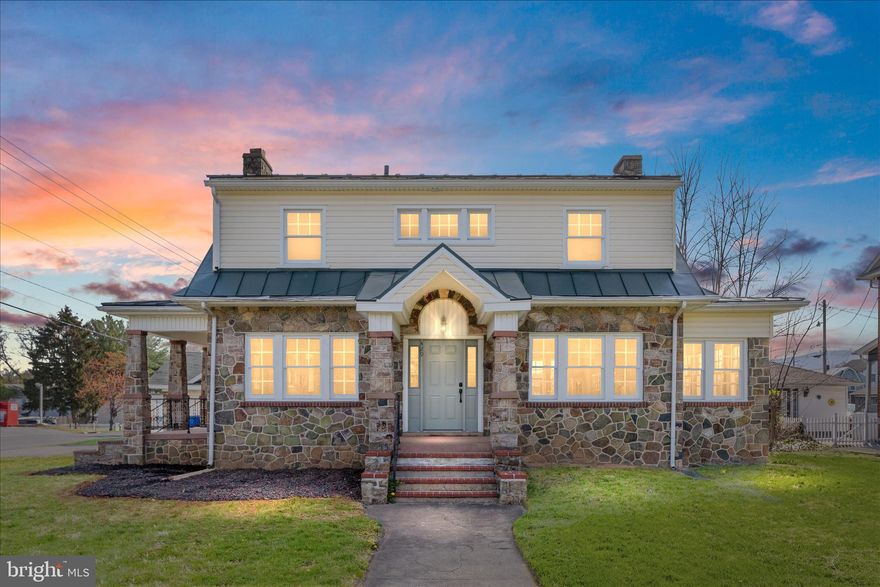 Beautifully remodeled commercial property situated on a desirable corner lot in Warren County, offering over 3,300 square feet of versatile space plus a partially finished basement. This stone bungalow, originally built in 1926, offers high visibility and easy access to major high-traffic routes (I-66/I-81 corridor, Routes 340 and 522), combining classic appeal with modern updates throughout. The flexible layout allows for a variety of business uses. The main level features a welcoming lobby/entrance, a conference room or private office, and beautifully refinished hardwood floors throughout. A painted stone, wood-burning fireplace with mantel adds character, along with a bright sunroom. There is also a designated area suitable for a kitchen or breakroom, built-ins, and a stunning stairwell leading to the upper level. Upstairs, you’ll find four spacious offices or conference rooms—each with closets—a comfortable sitting area, and additional refinished hardwood flooring. A full bathroom with a stand-up shower and luxury vinyl plank flooring completes the upper level. Each level is equipped with its own HVAC system for added efficiency and comfort. The conditioned basement includes a bonus room, two storage rooms with luxury vinyl plank flooring, and an unfinished utility room with painted concrete flooring. Exterior features include a covered side porch, rear covered porch, and a charming front porch with columns—all with stair access. Additional highlights include a metal roof, rear fencing, and a 17’ x 21’ stone storage building with electricity. An additional vacant lot located at the rear of the property offers potential for parking, expansion, or future development.