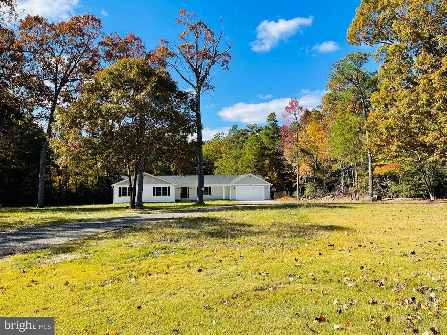 Gorgeous Rambler on a private 15 acre lot with no HOA.   4 bedrooms and 2.5 baths. It includes vinyl plank floors in the kitchen, family room, dining room and hallway. The kitchen has white cabinets, quartz counter tops, a center island, stainless steel appliances and a spacious pantry. The  primary suite has a tray ceiling, walk-in-closet, bathroom with double vanity, tile shower & two shower heads. There is a mudroom located off the 2 car garage. House has sprinkler system. The exterior has a welcoming front porch.
